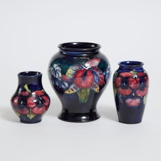Two Moorcroft Pansy Vases and an Orchids Vase, 20th century -