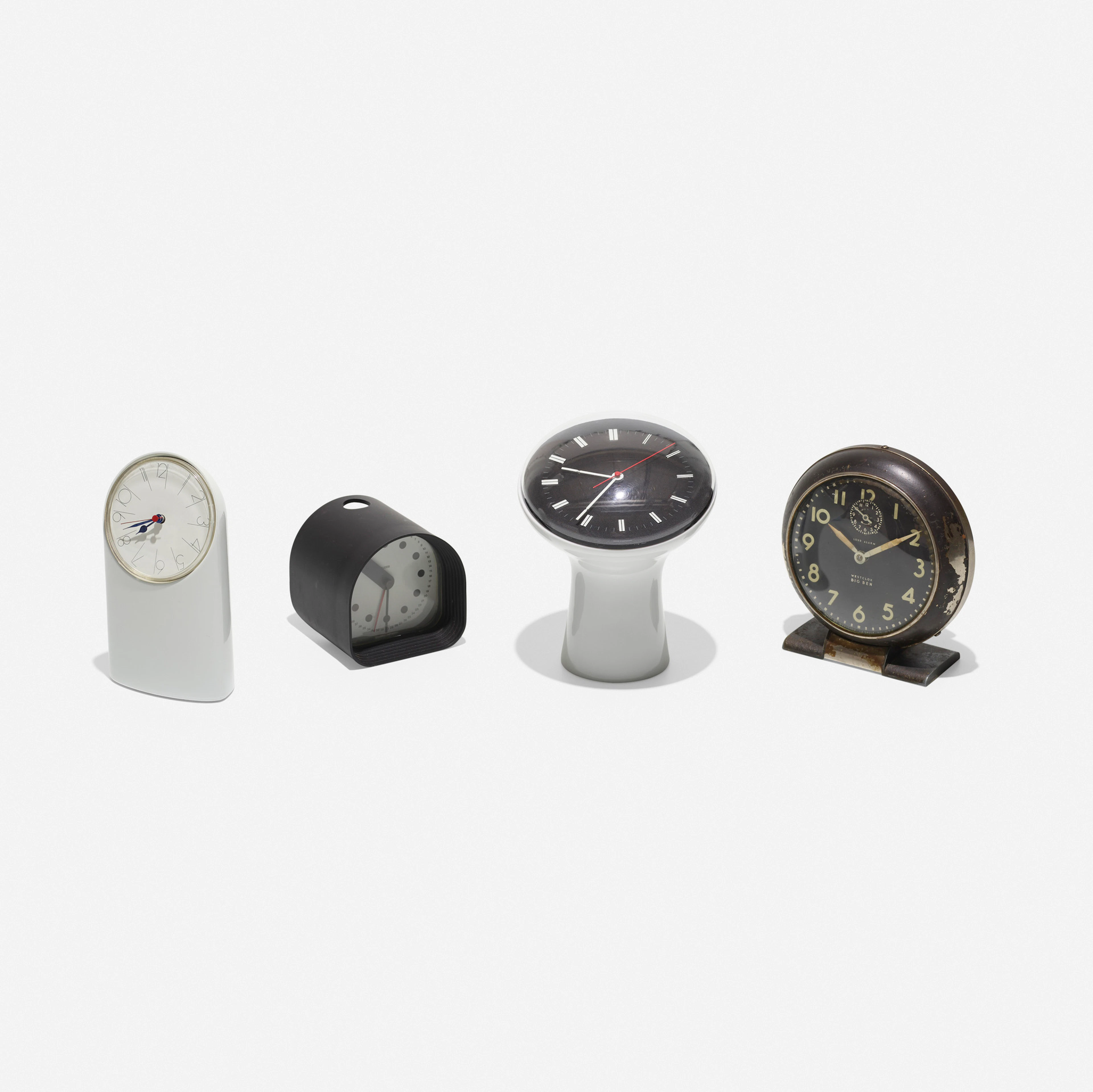 collection of four table clocks