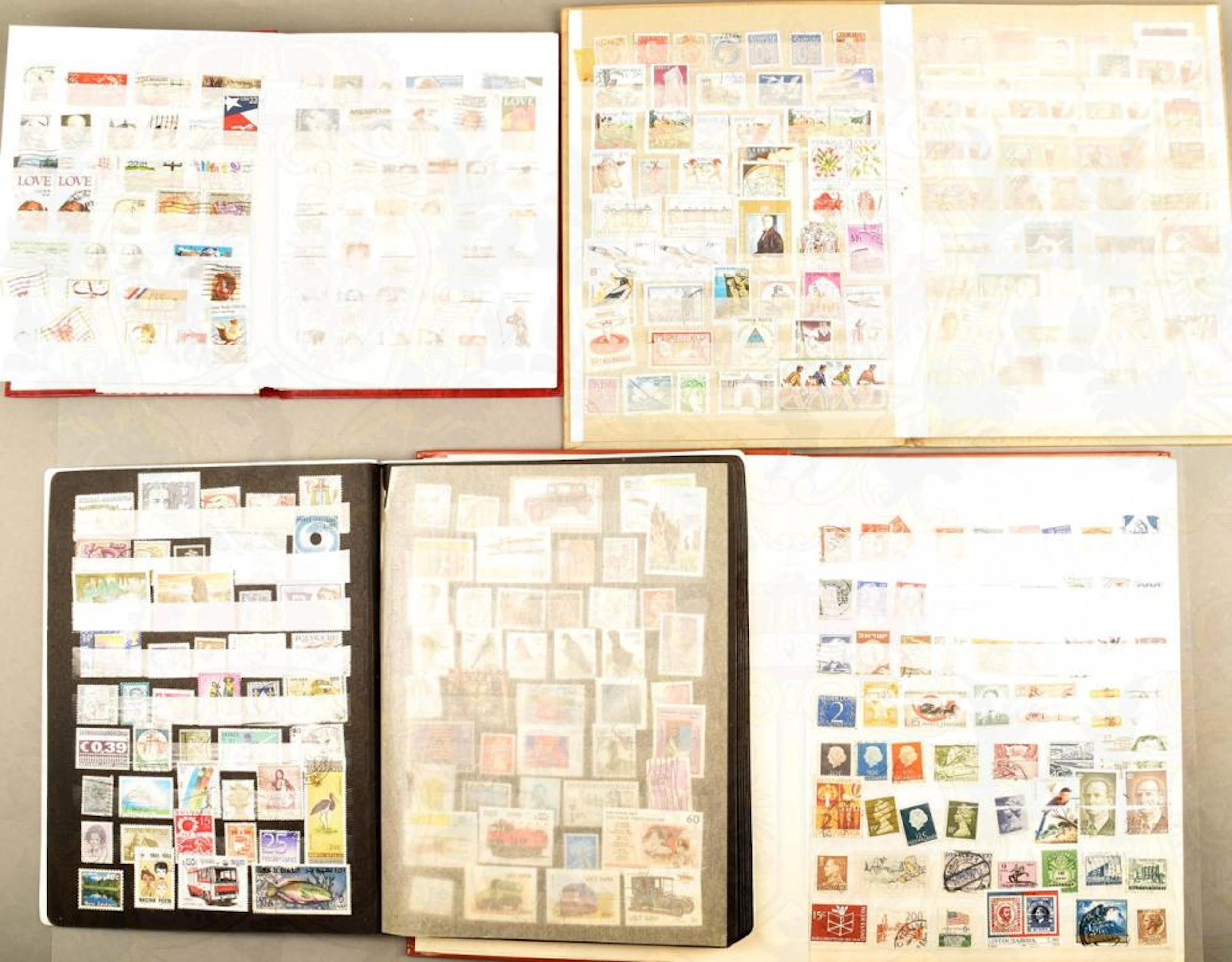 5 STAMP ALBUMS WITH 4380 INTERNATIONAL STAMPS