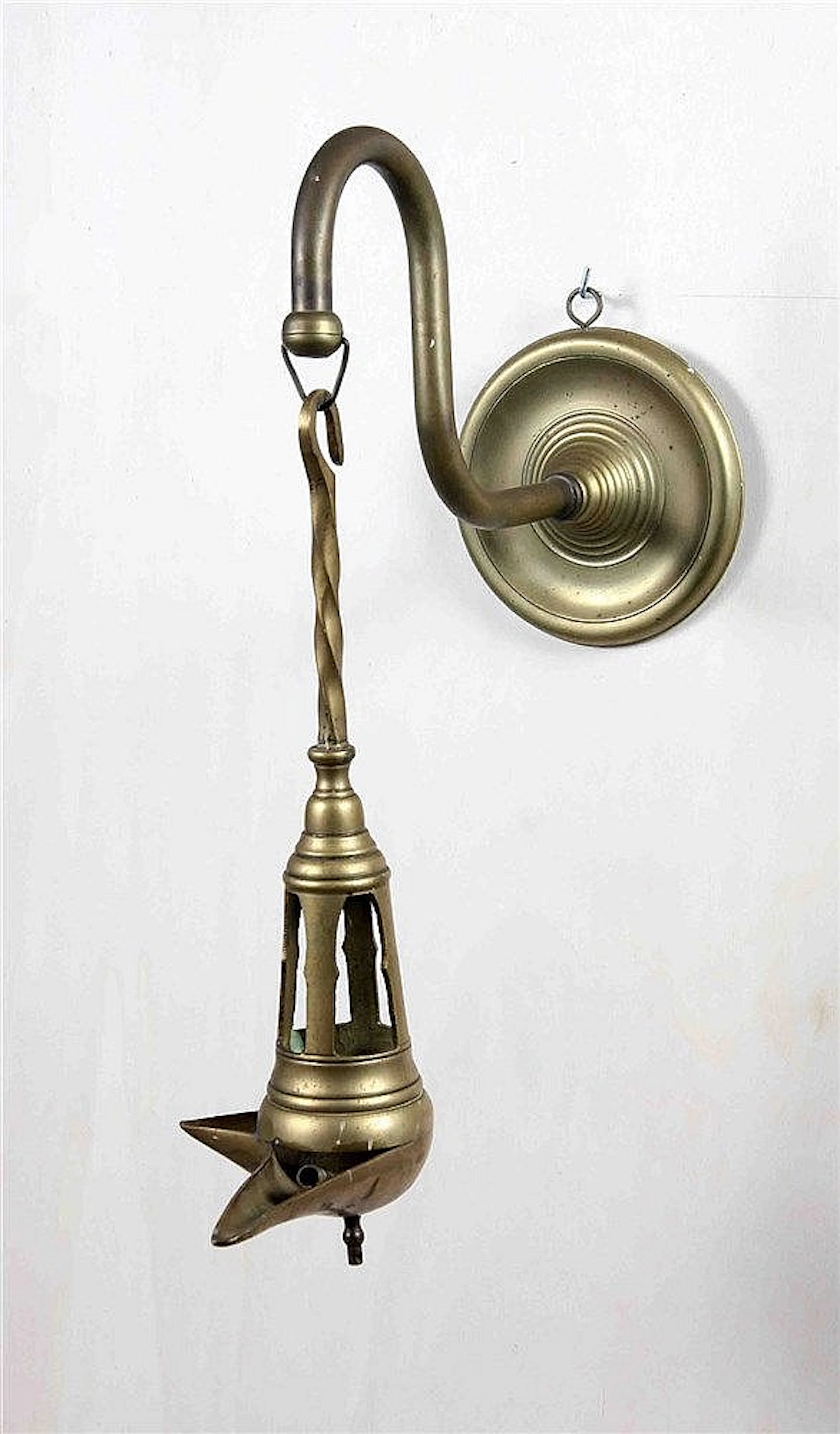 AN ARABIC BRONZE OIL LAMP