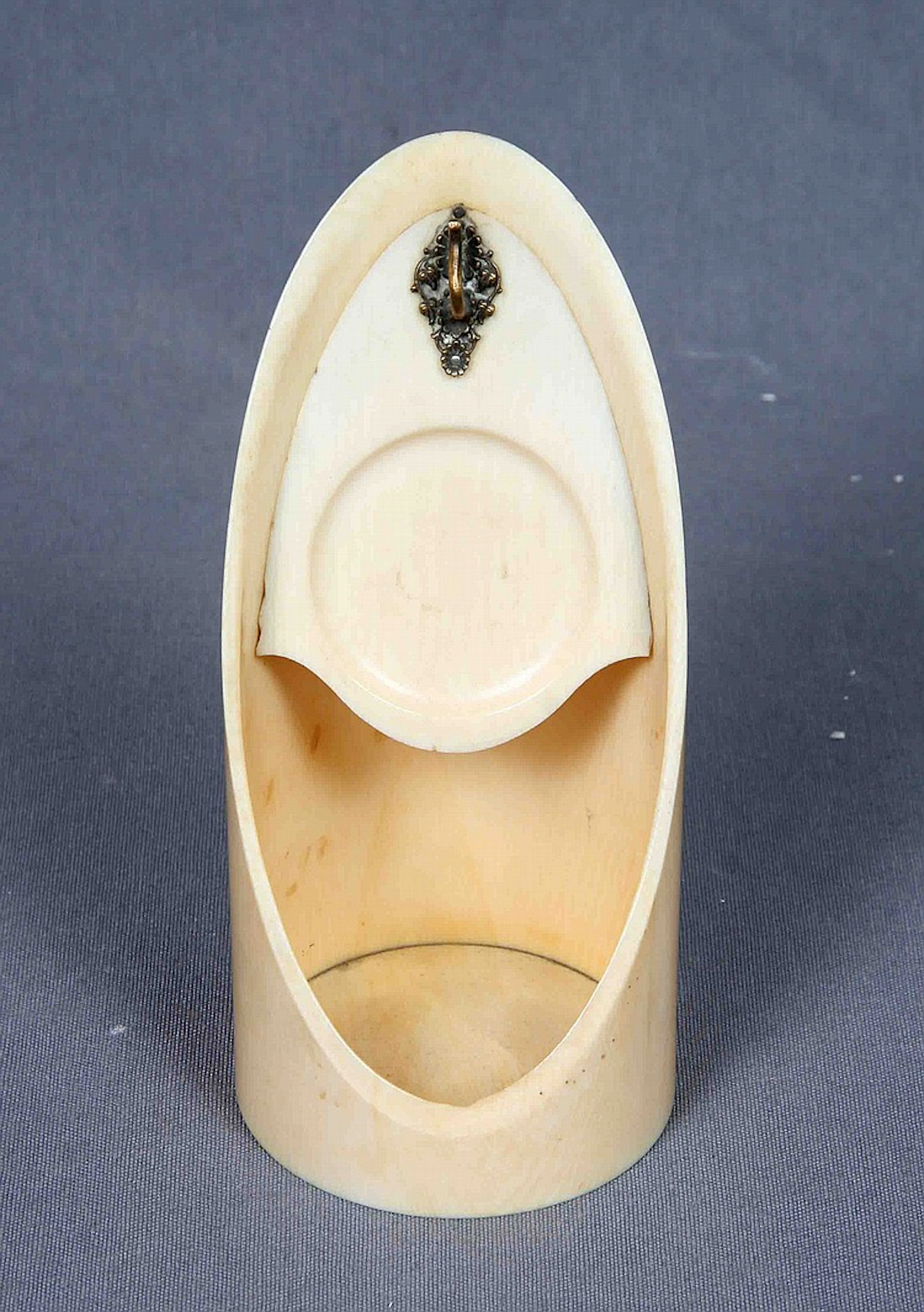 A CARVED IVORY POCKET WATCH STAND