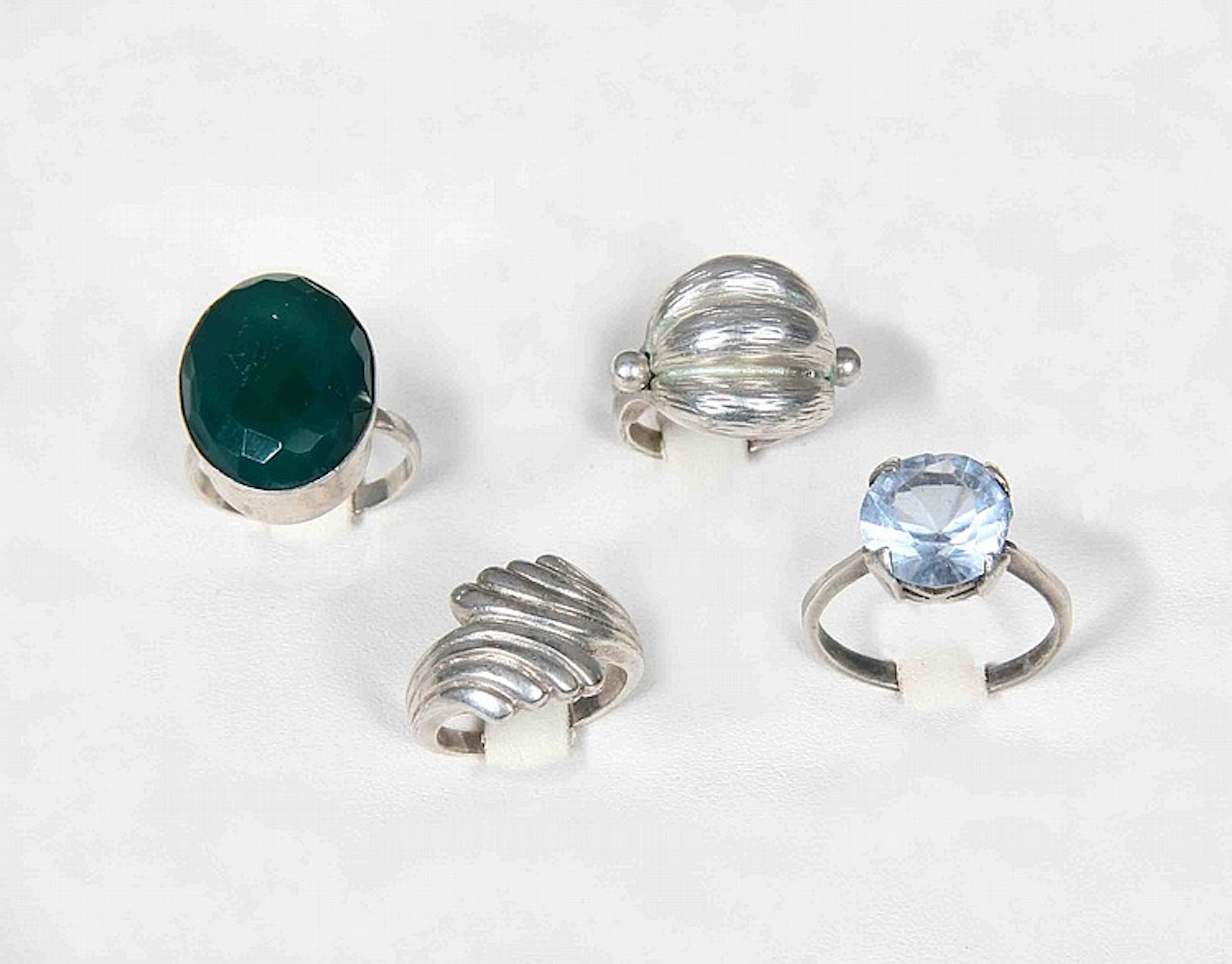 FOUR SILVER RINGS
