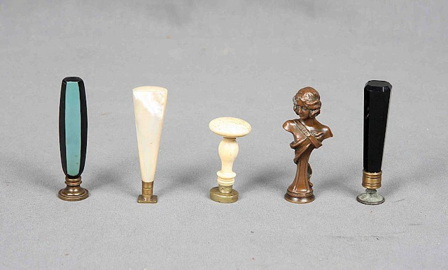 A GROUP OF FIVE ART DECO STYLE DESK SEALS