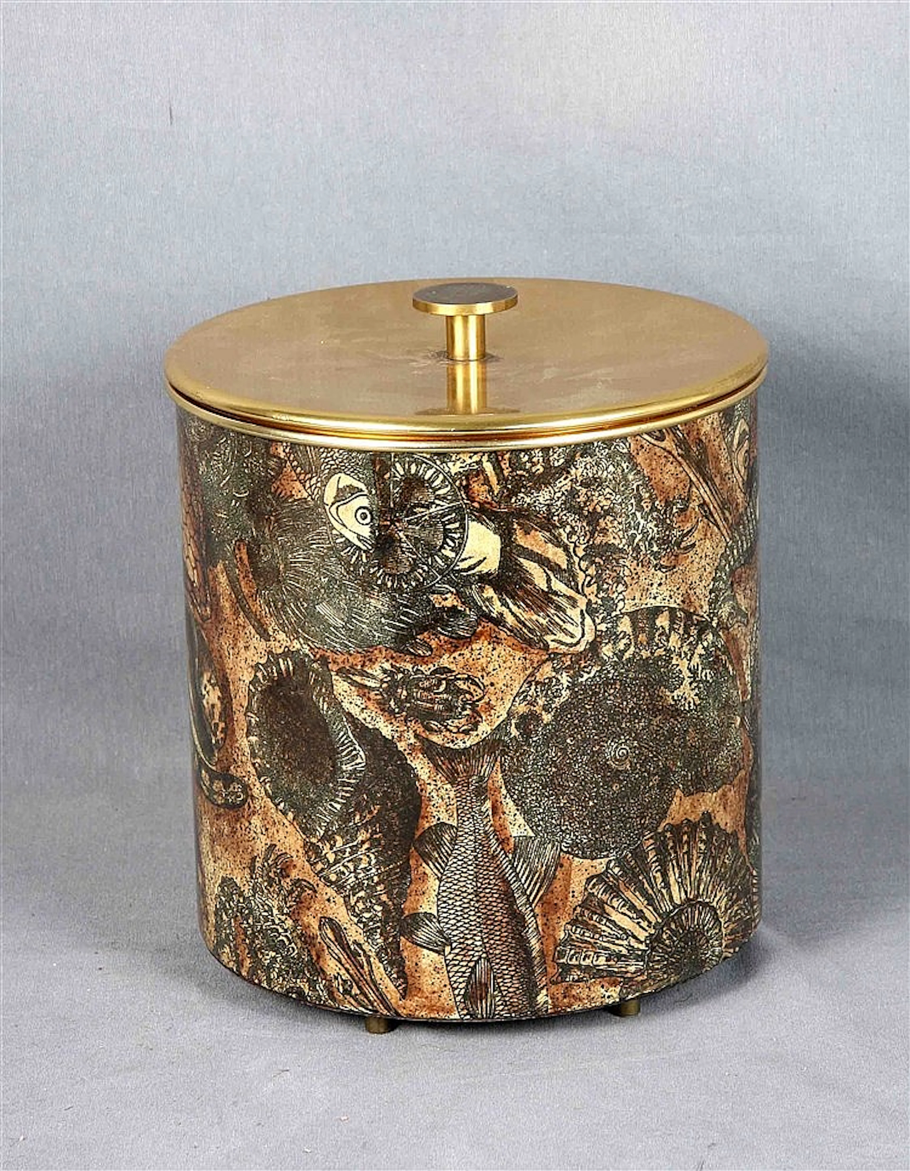 Italian ice tray of the firm FORNASETTI MILANO, in gold and with decoration