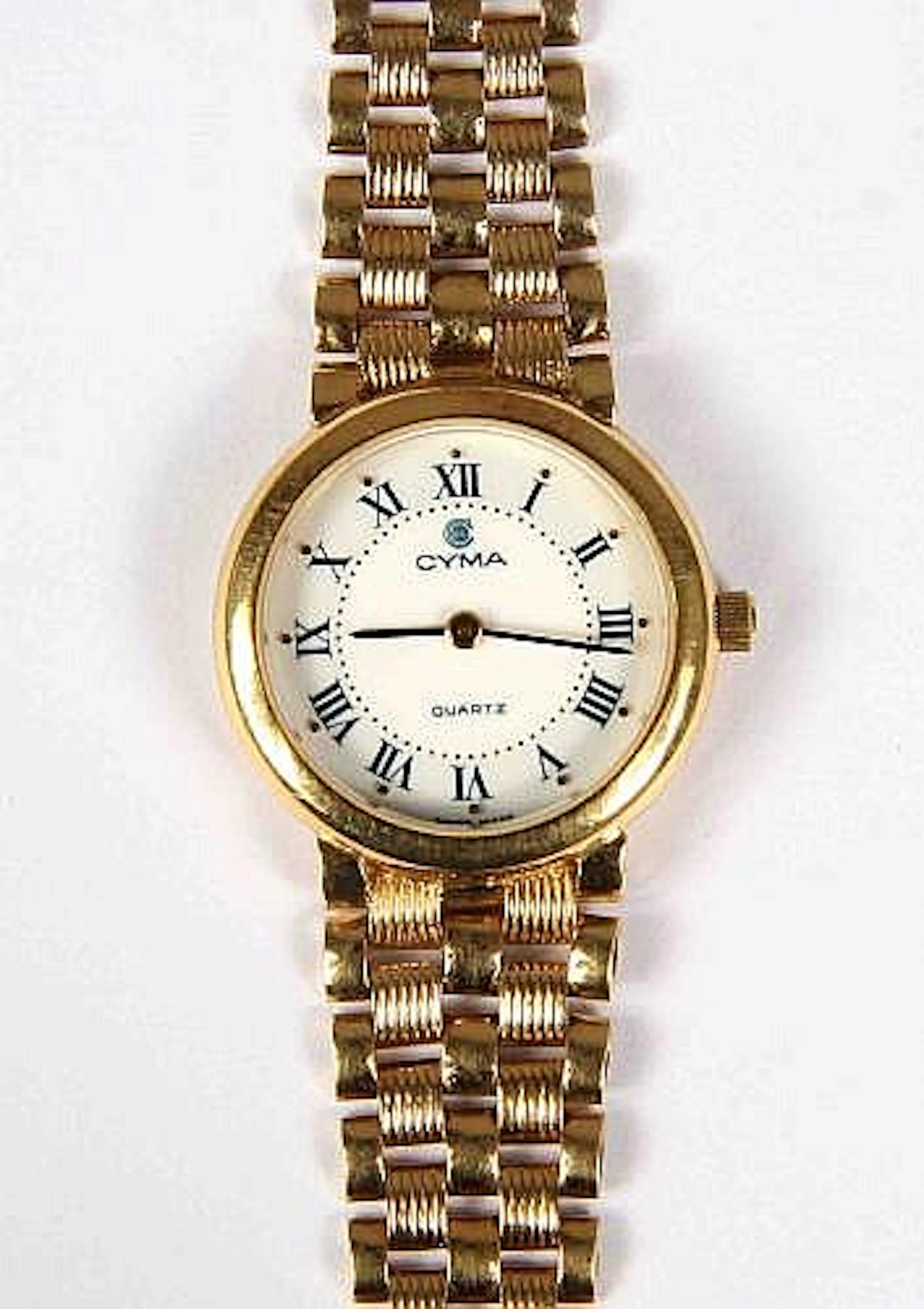 Reloj de pulsera en oro de la marca CYMA, esfera circular en