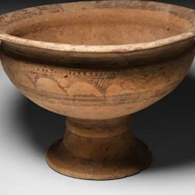 A ceramic chalice composed of a bowl with convex wall, everted rim ...