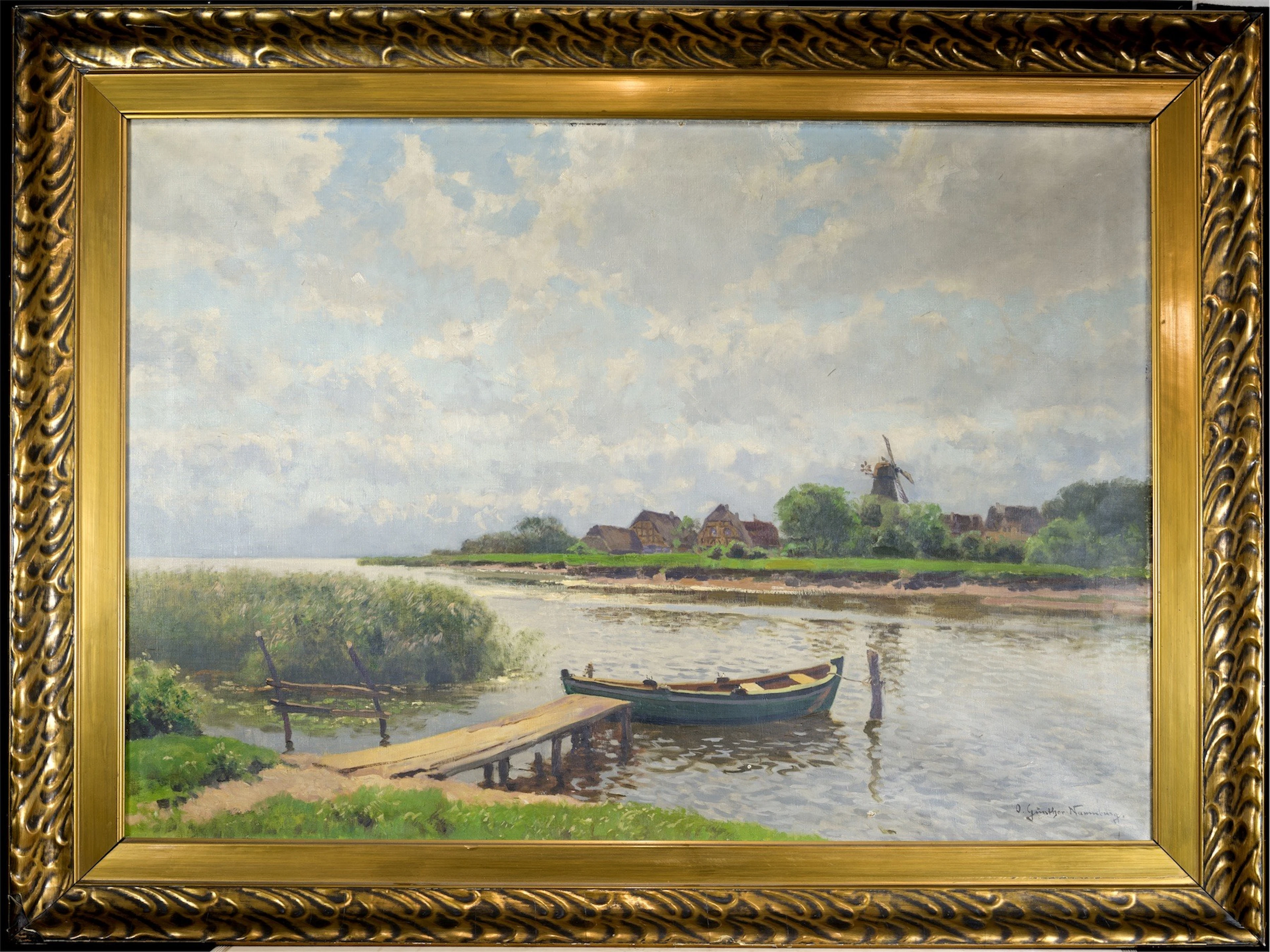 OTTO GÜNTHER-NAUMBURG (1856 NAUMBURG - 1941 BERLIN). Norddeutsche Flusslandschaft mit Bootsanleger und Reethäusern, im Hintergrund eine Windmühle. Öl auf Leinwand