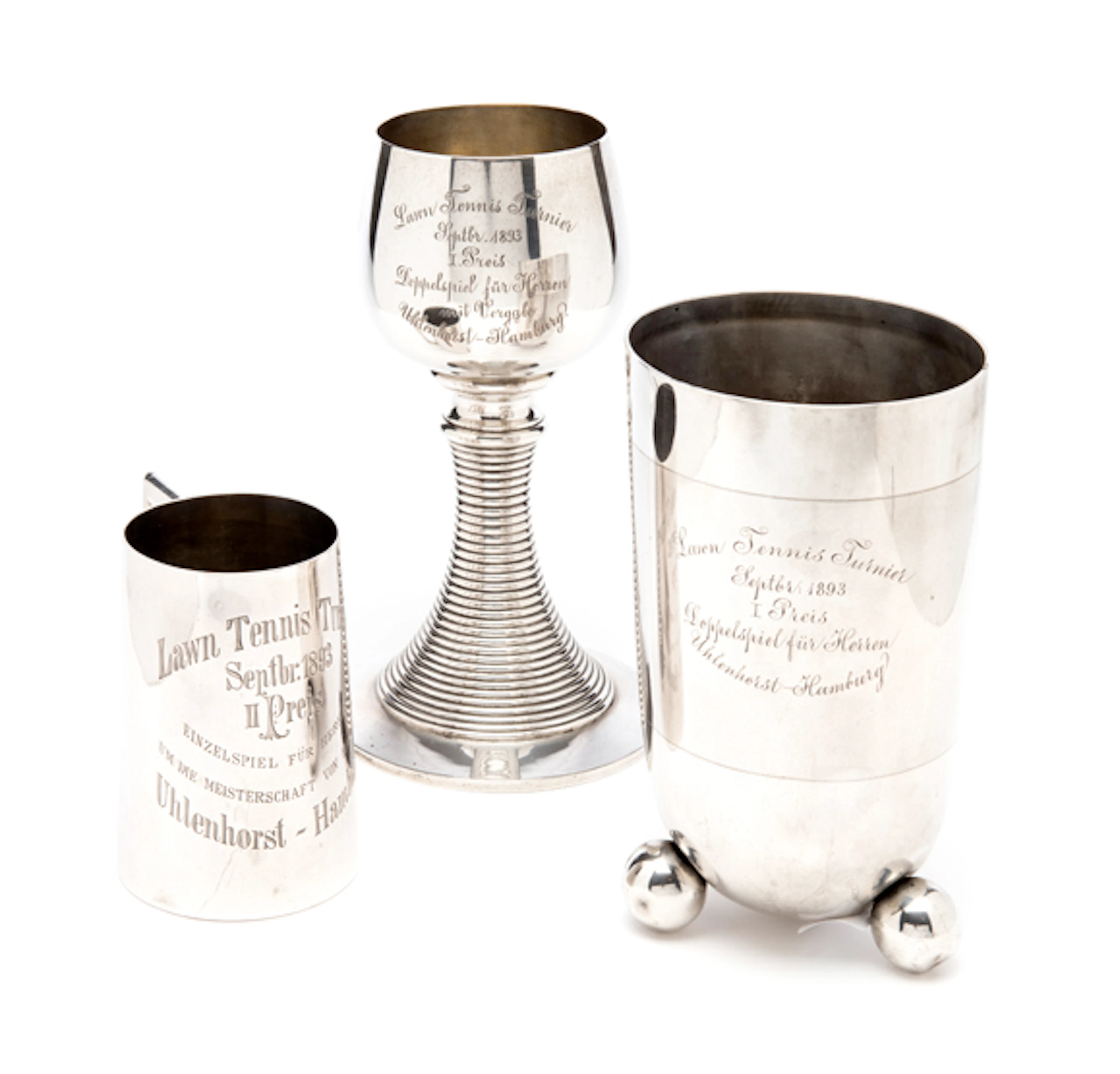 A trio of silver trophies presented at the Lawn Tennis Championships at the