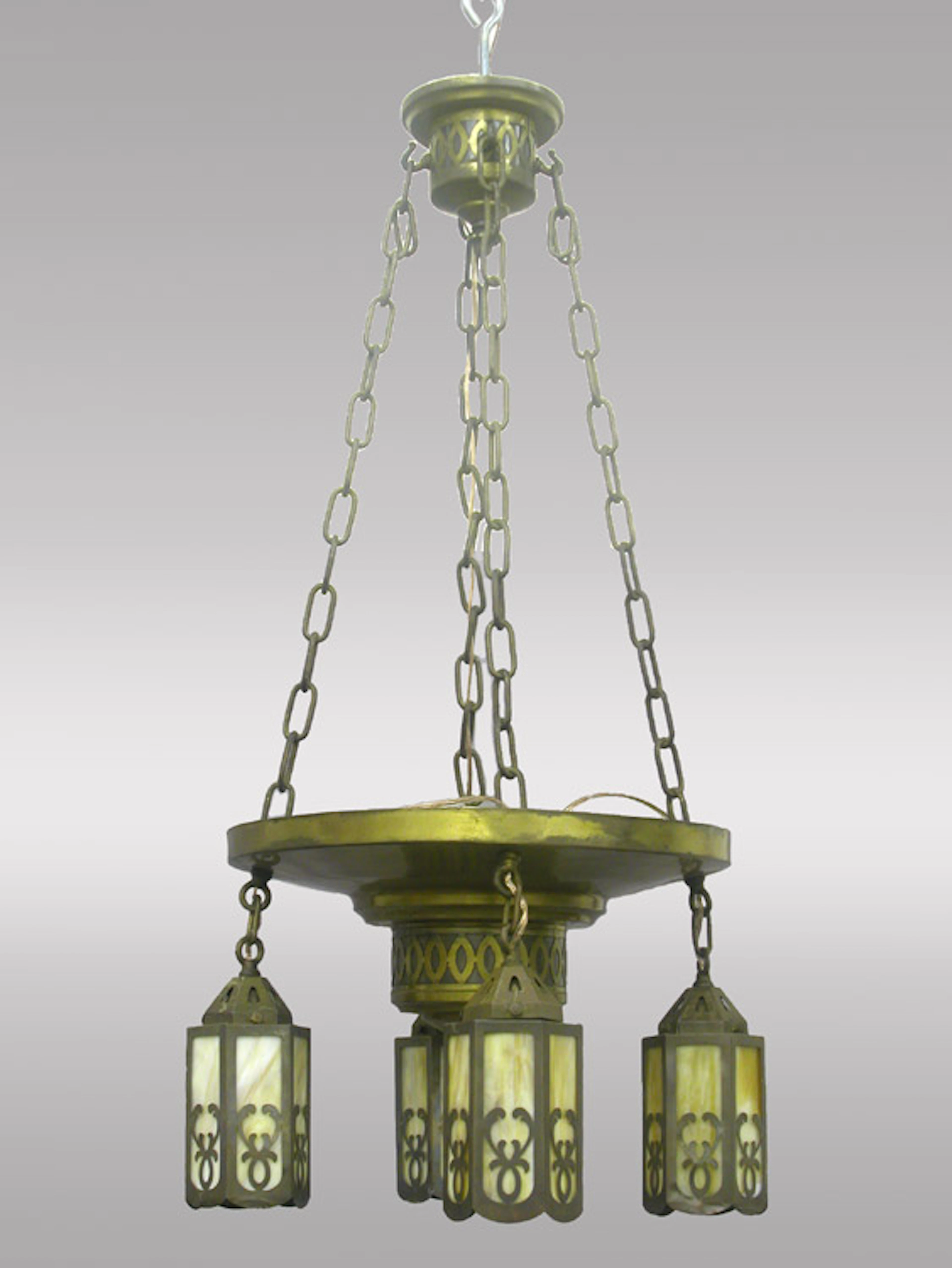 An Arts and Crafts chandelier with four slag glass