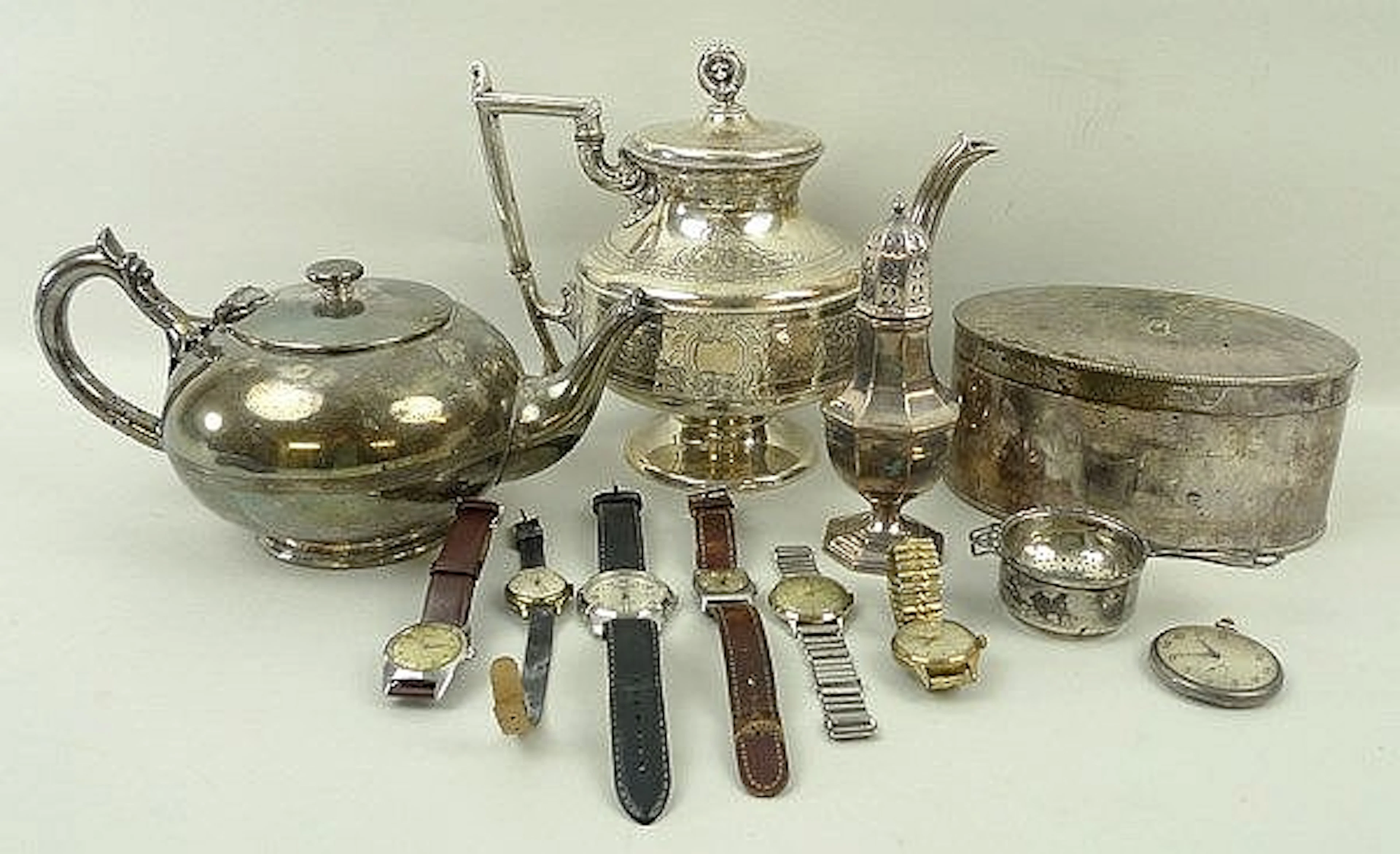 A group of silver, plate and watches, including a silver tea strainer, Adie Bros