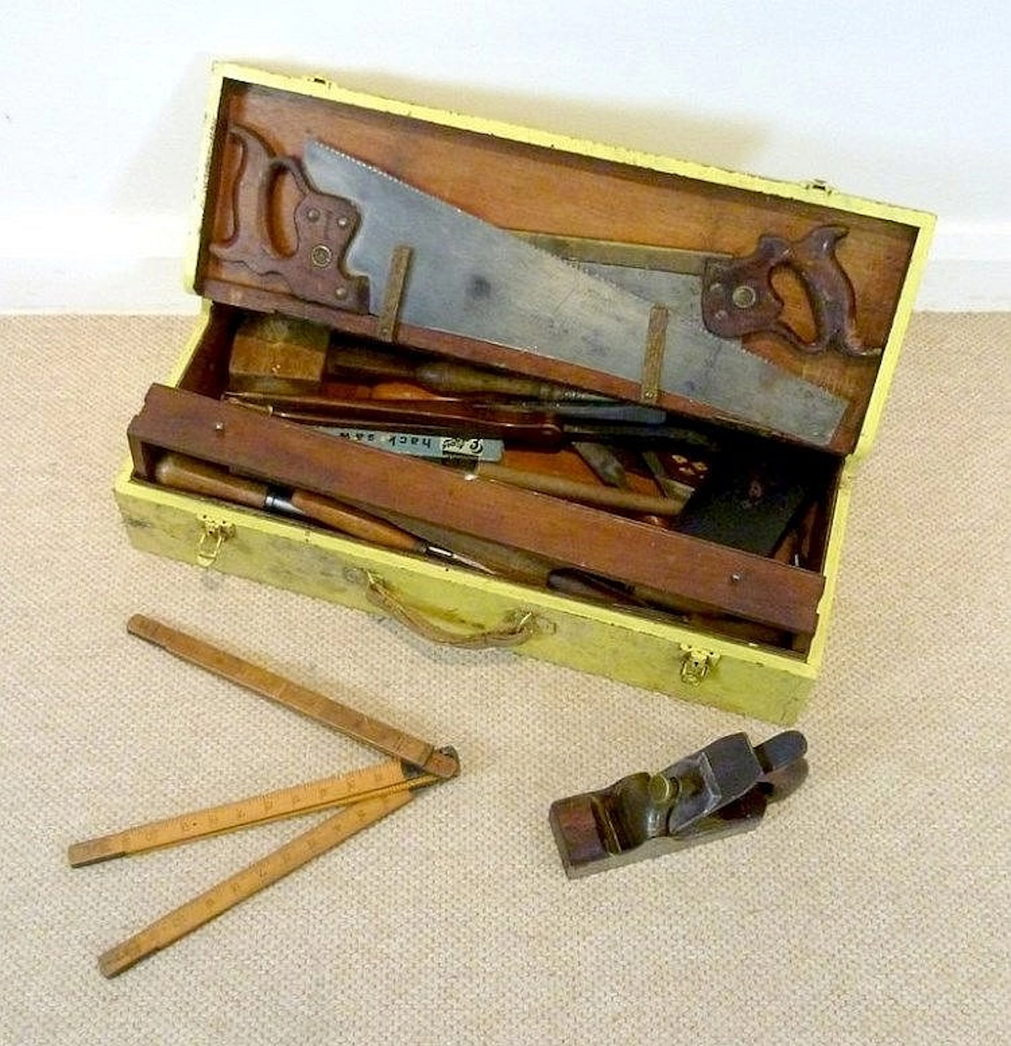 A set of vintage tools and carry toolbox painted yellow