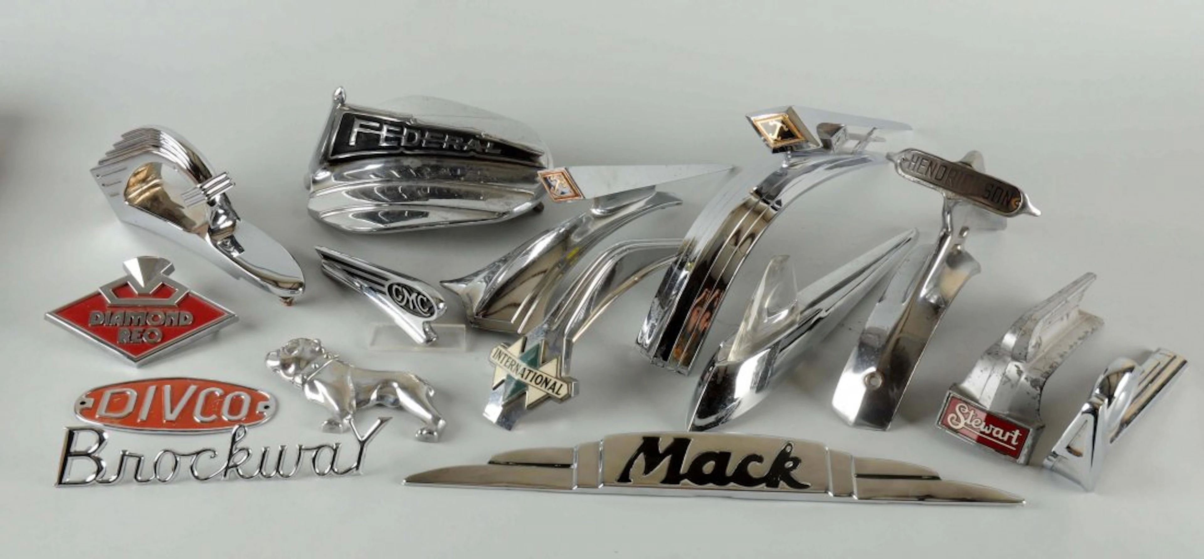 Lot of 11: Truck Hood Ornates.