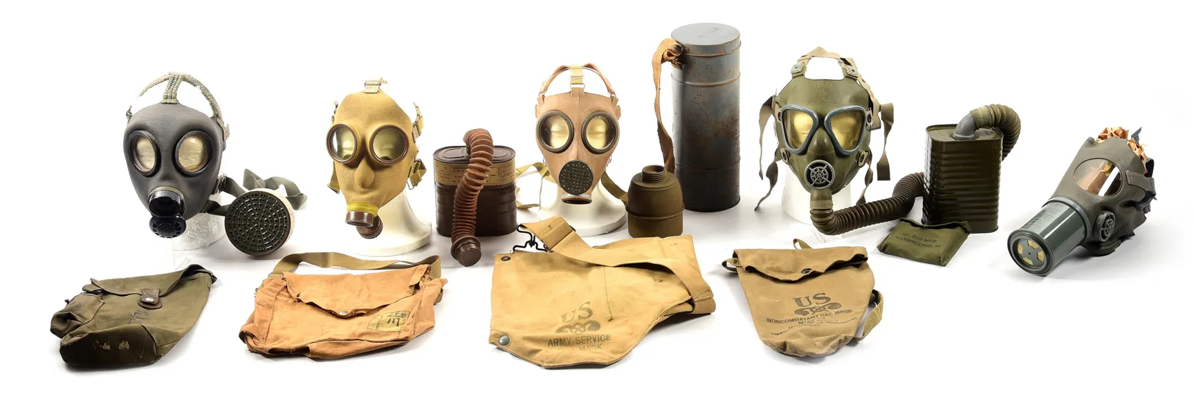 Lot consists of: (A) French Model C38 gas mask with canister | Barnebys