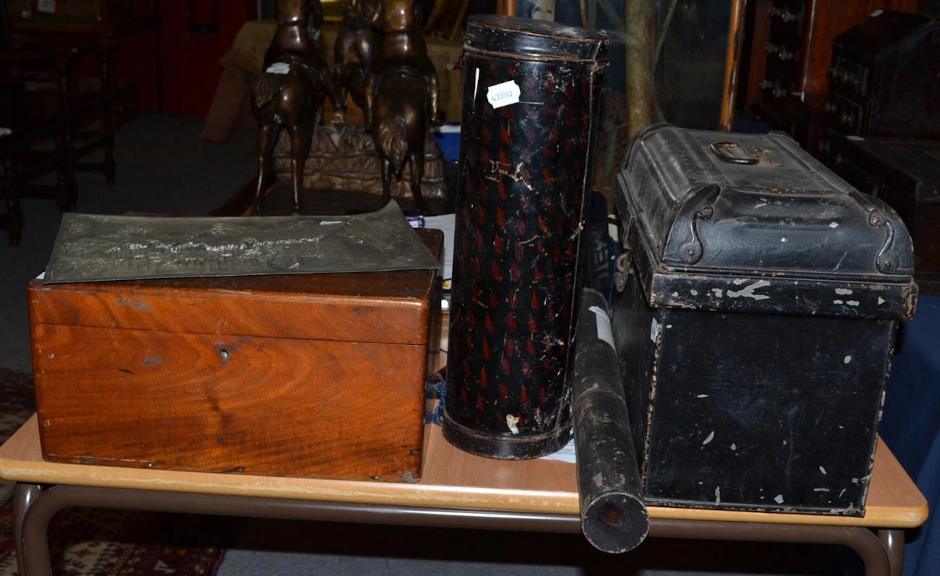 A black painted tin small trunk