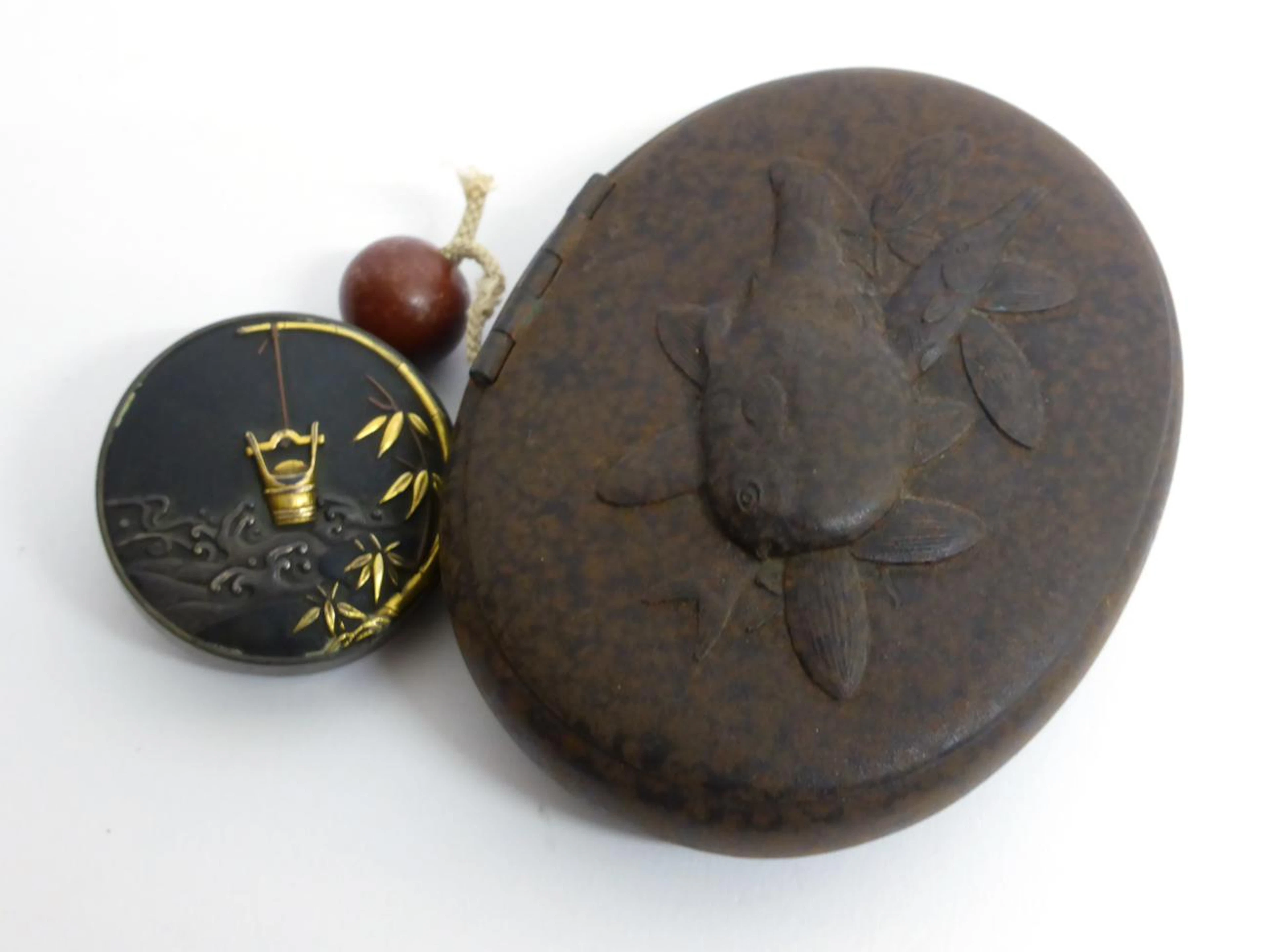 A Gold Inlaid Iron and Karakuri Netsuke