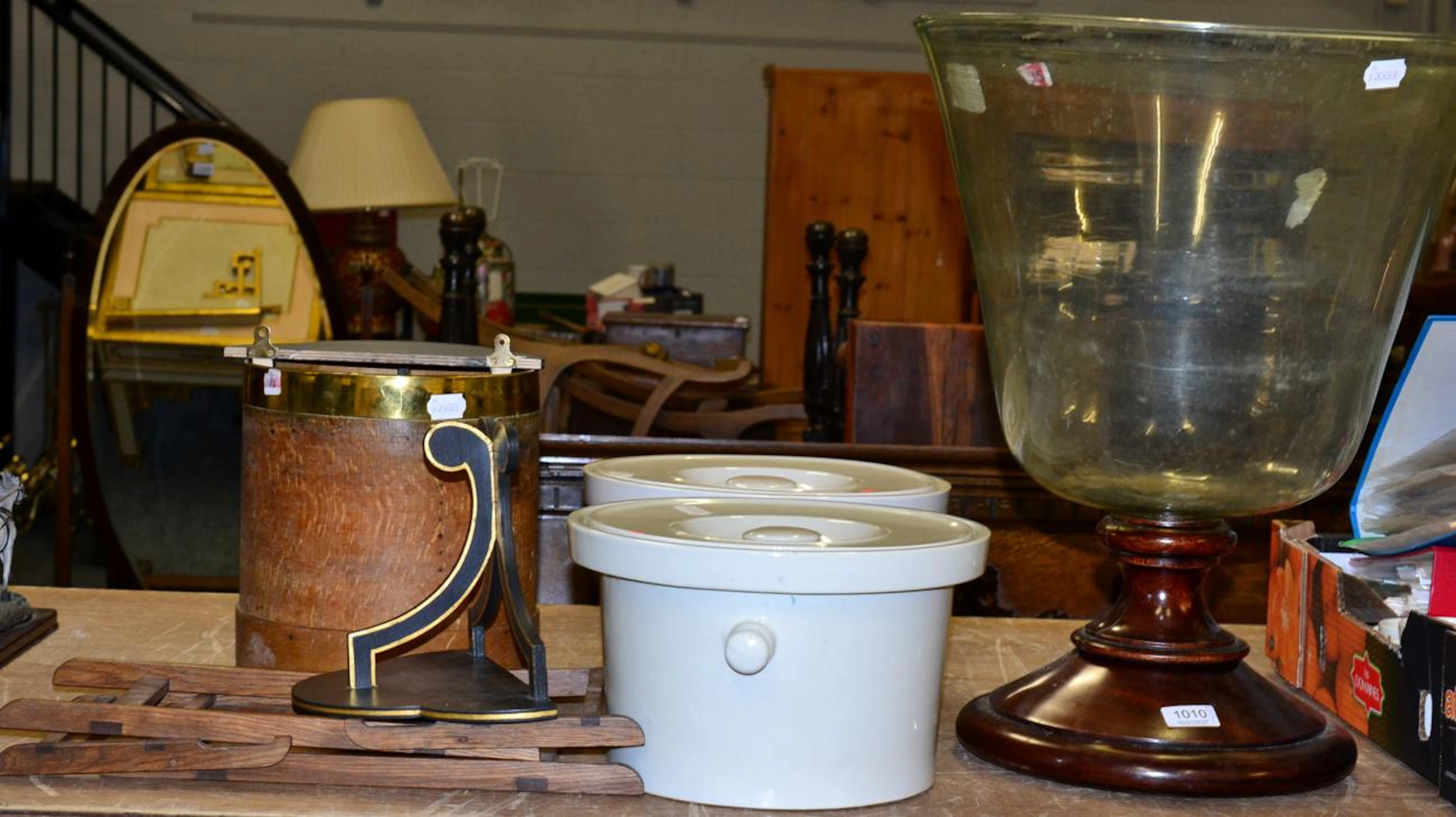 A large Victorian glass vessel with turned mahogany foot