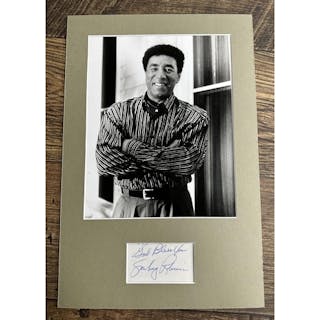 Smokey Robinson - autograph in blue pen on paper, mounted be...