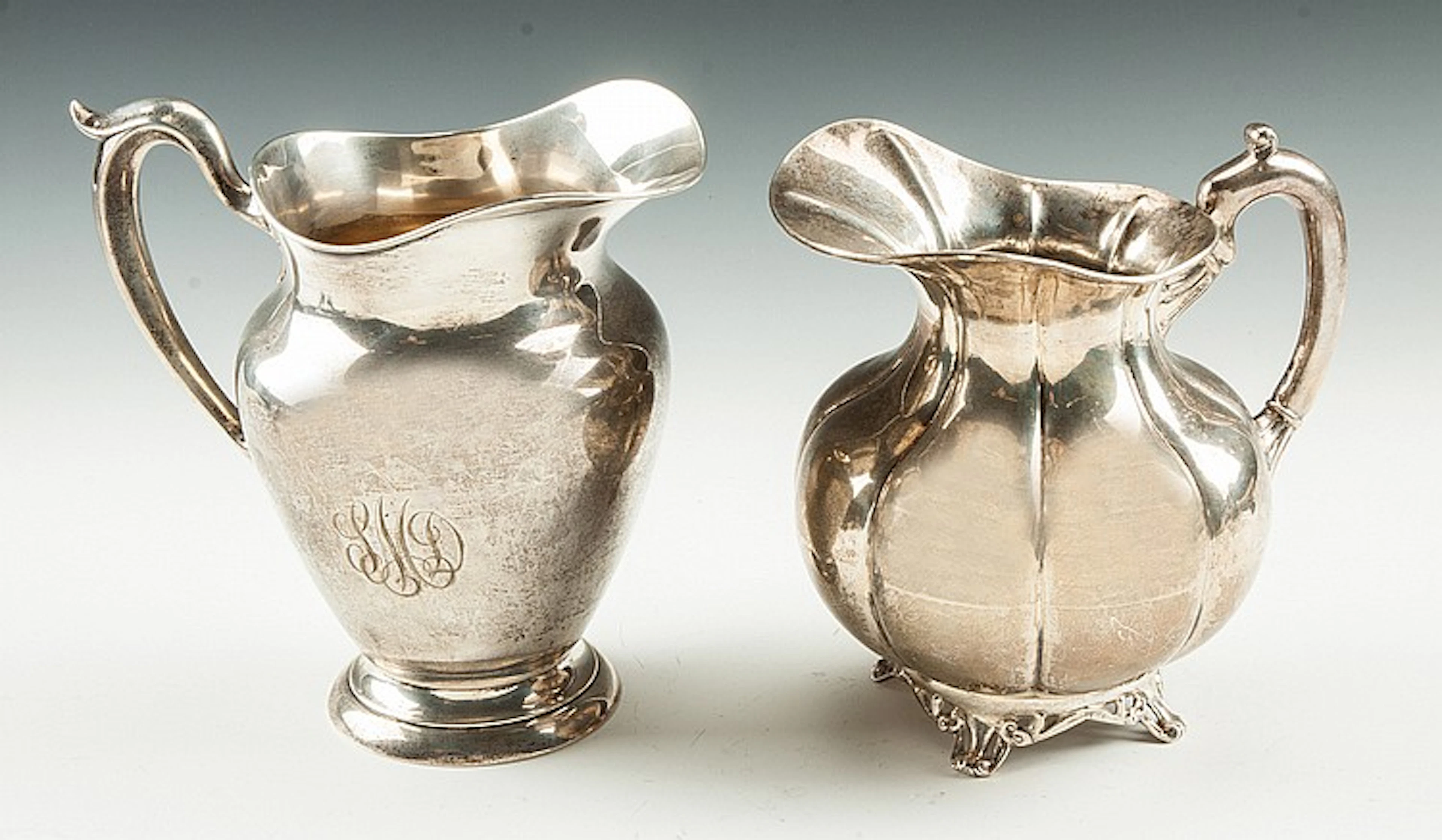 Two Sterling Silver Water Pitchers