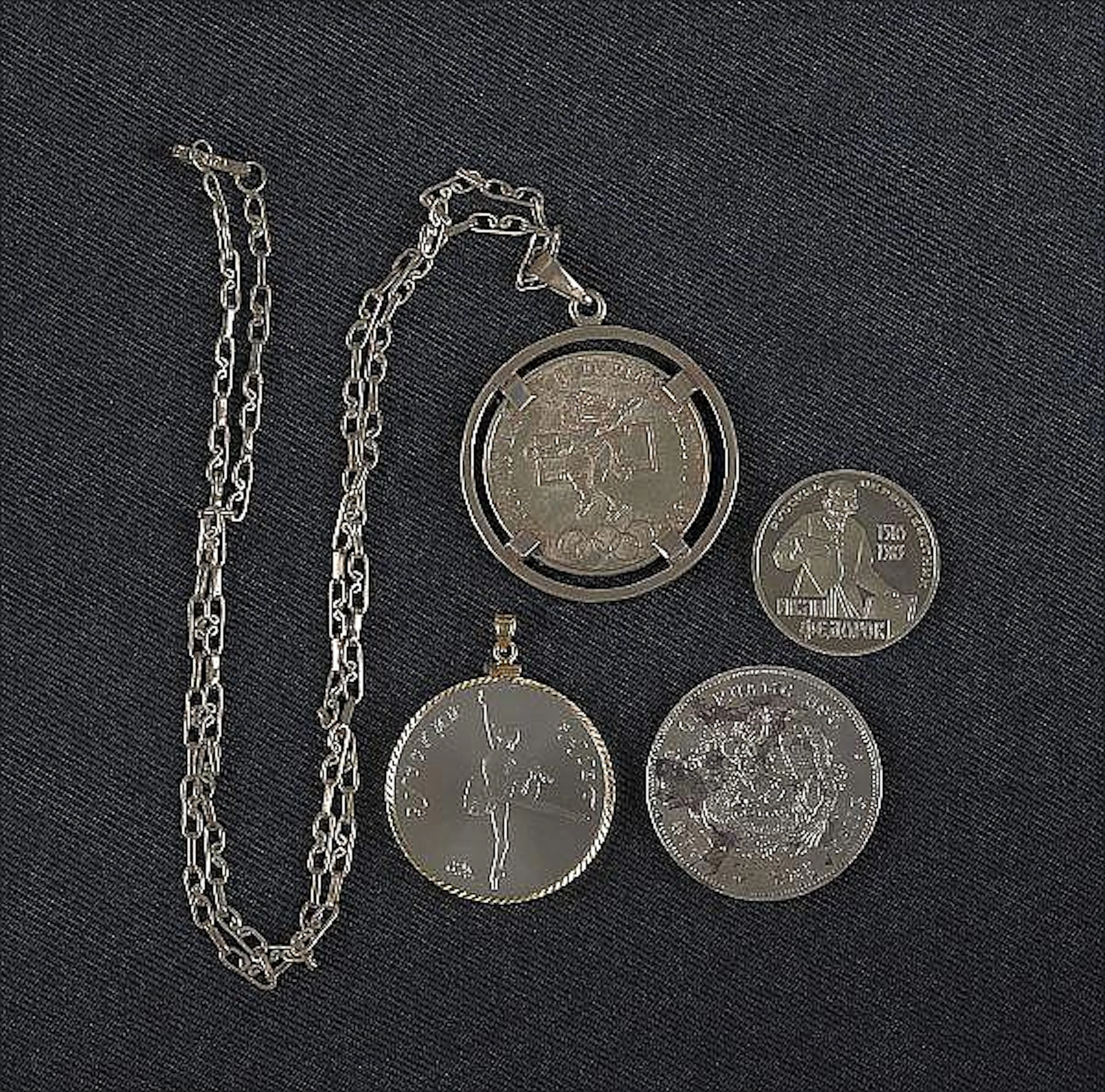 Two Russian commemorative coins together with a