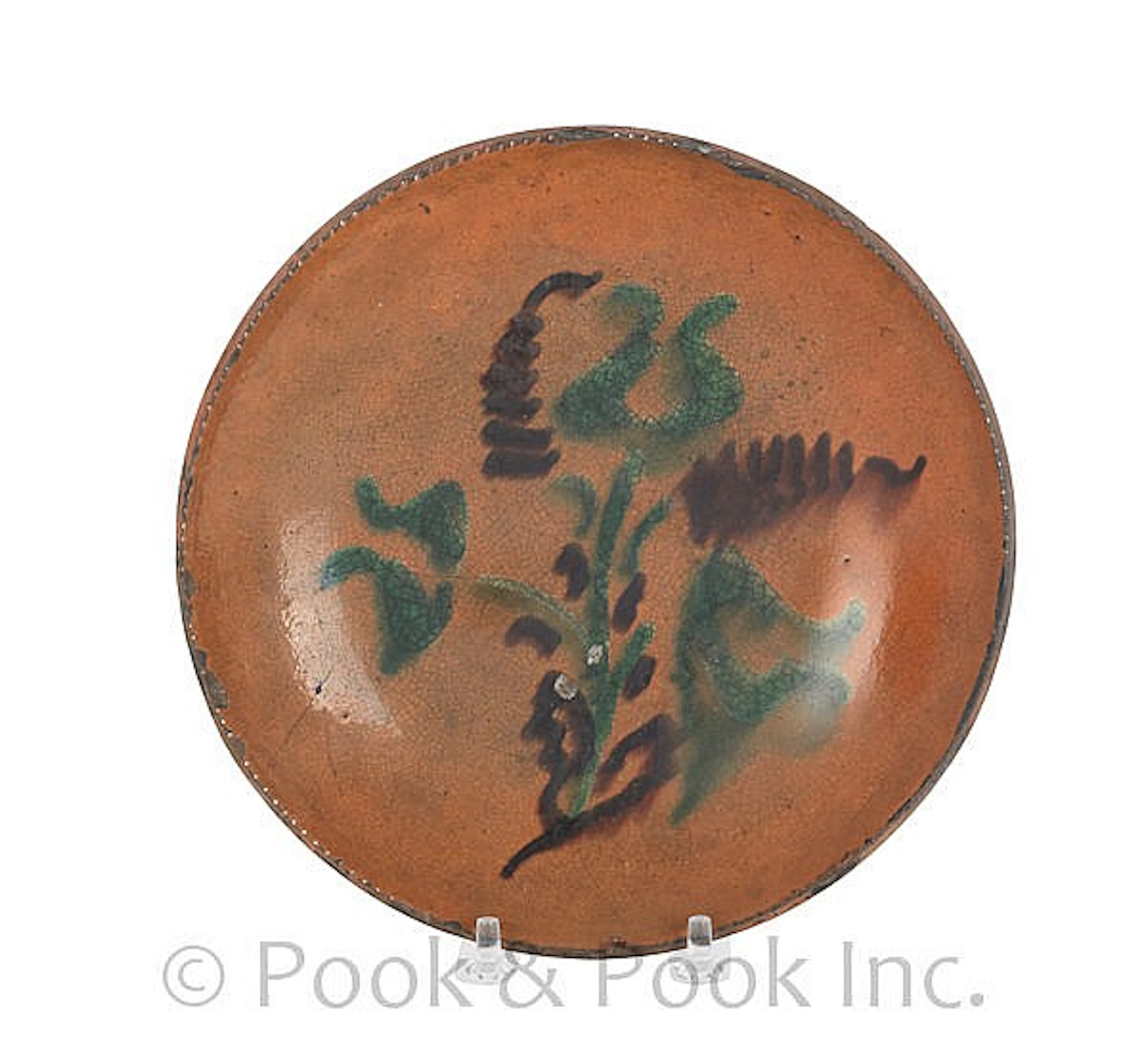 Pennsylvania redware pie plate, 19th c., with slip