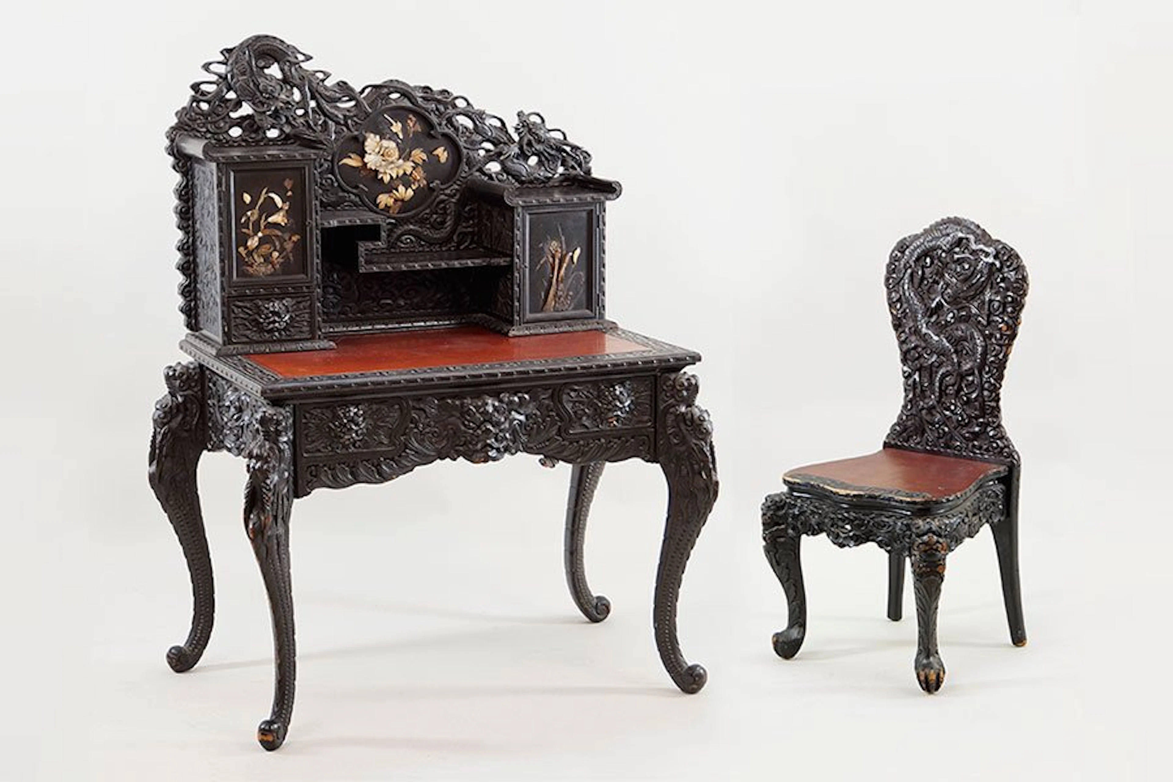 A Chinese Carved Wood Desk and Chair.