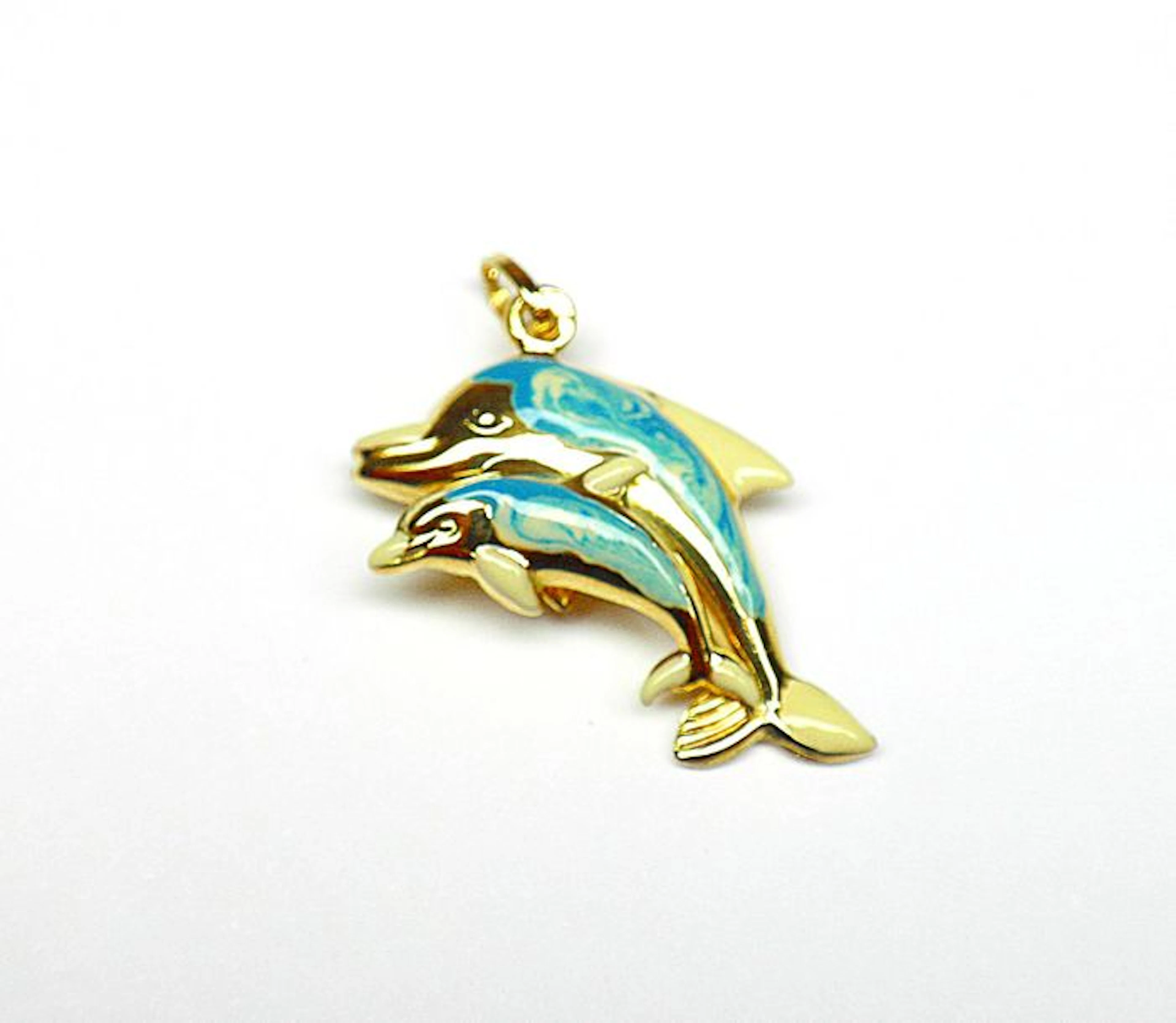 Très joli pendentif "dauphins", un côté en…