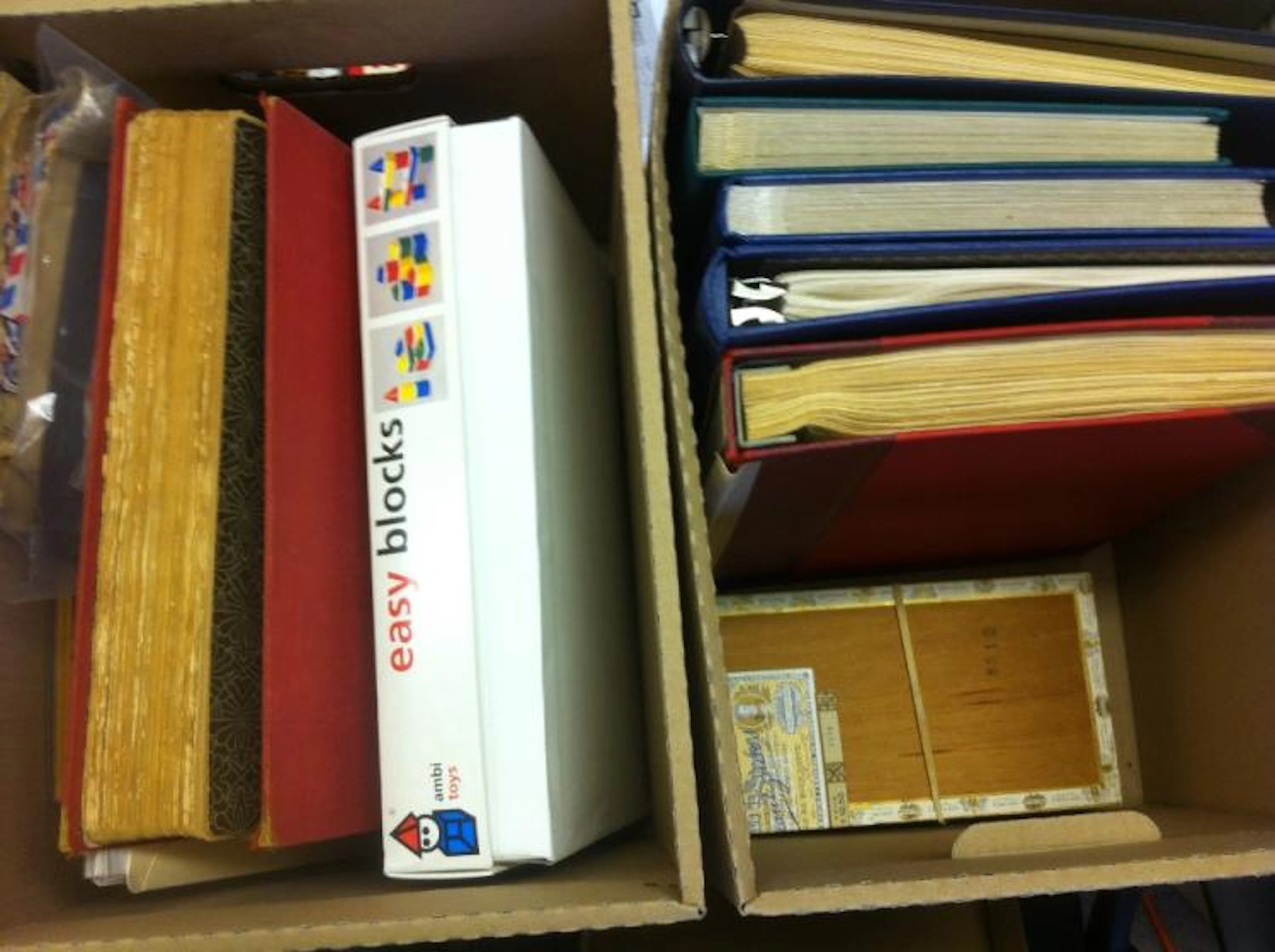 World stamps accumulation in two boxes with various albums