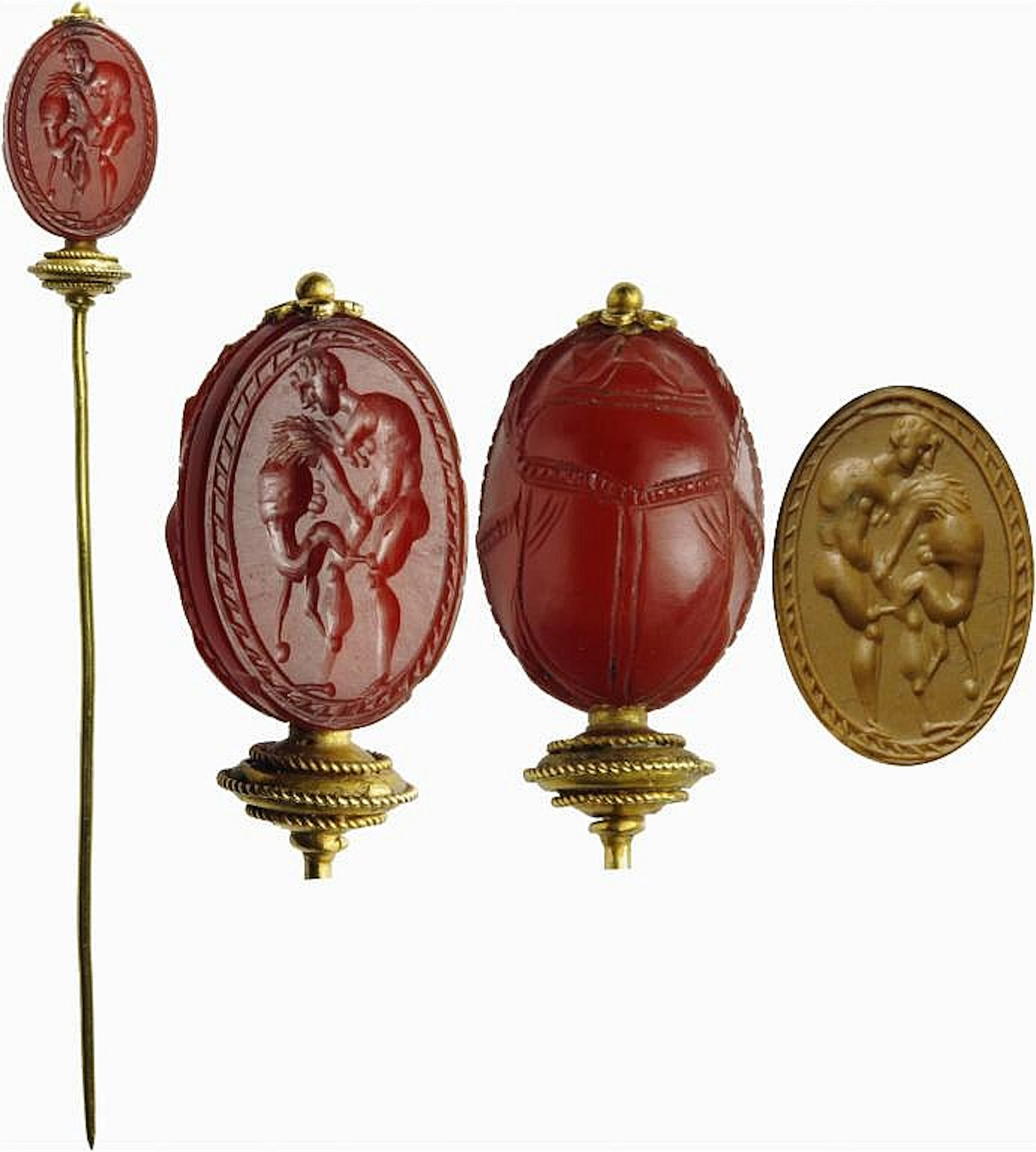 Etruscan scarab in carnelian set on golden pin. Herakles and the Nemean lion.