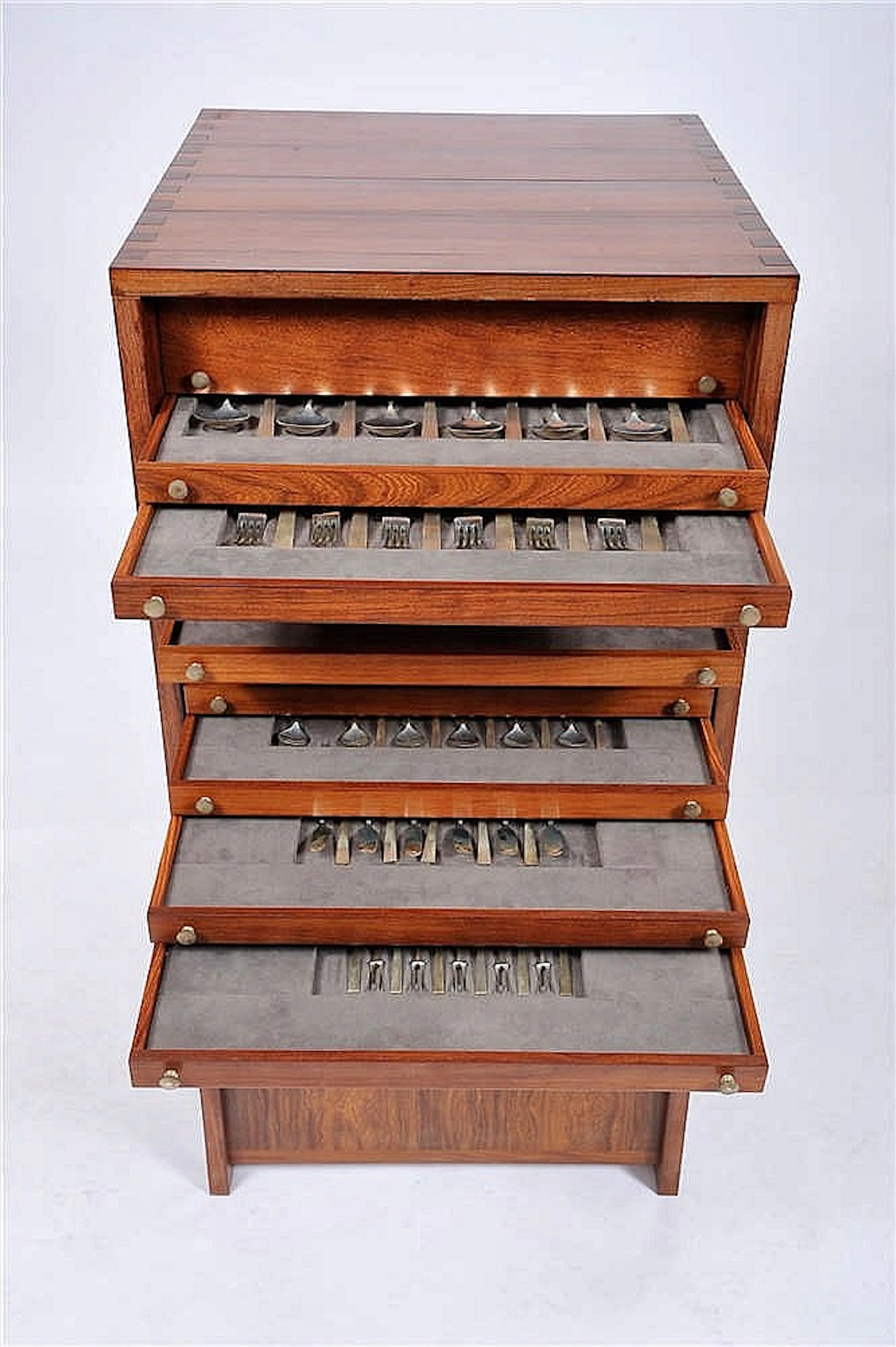 A Flatware Cabinet with Flatware for 11 People