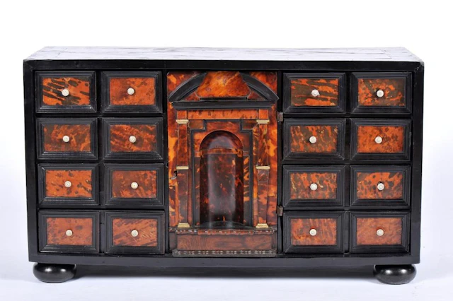 An eight-drawer cabinet simulating sixteen with central...