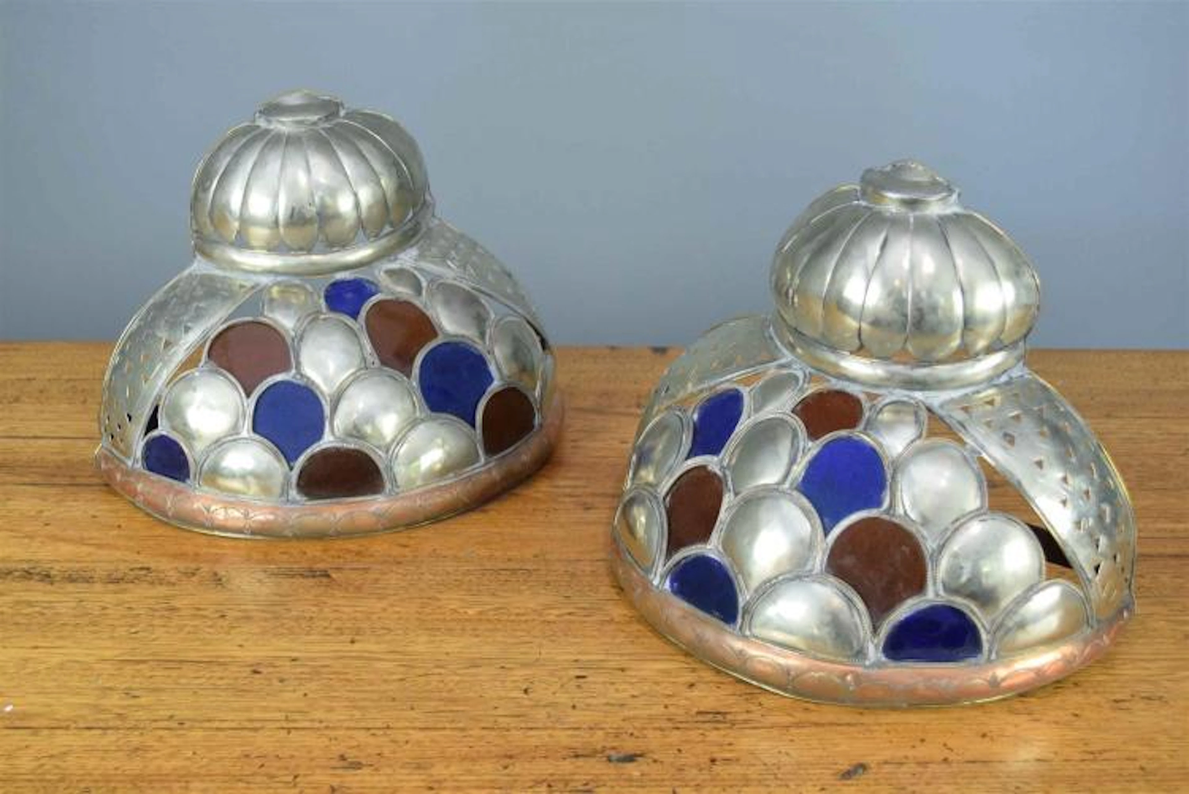 A PAIR OF MOROCCAN SILVER AND GLASS SCONCES