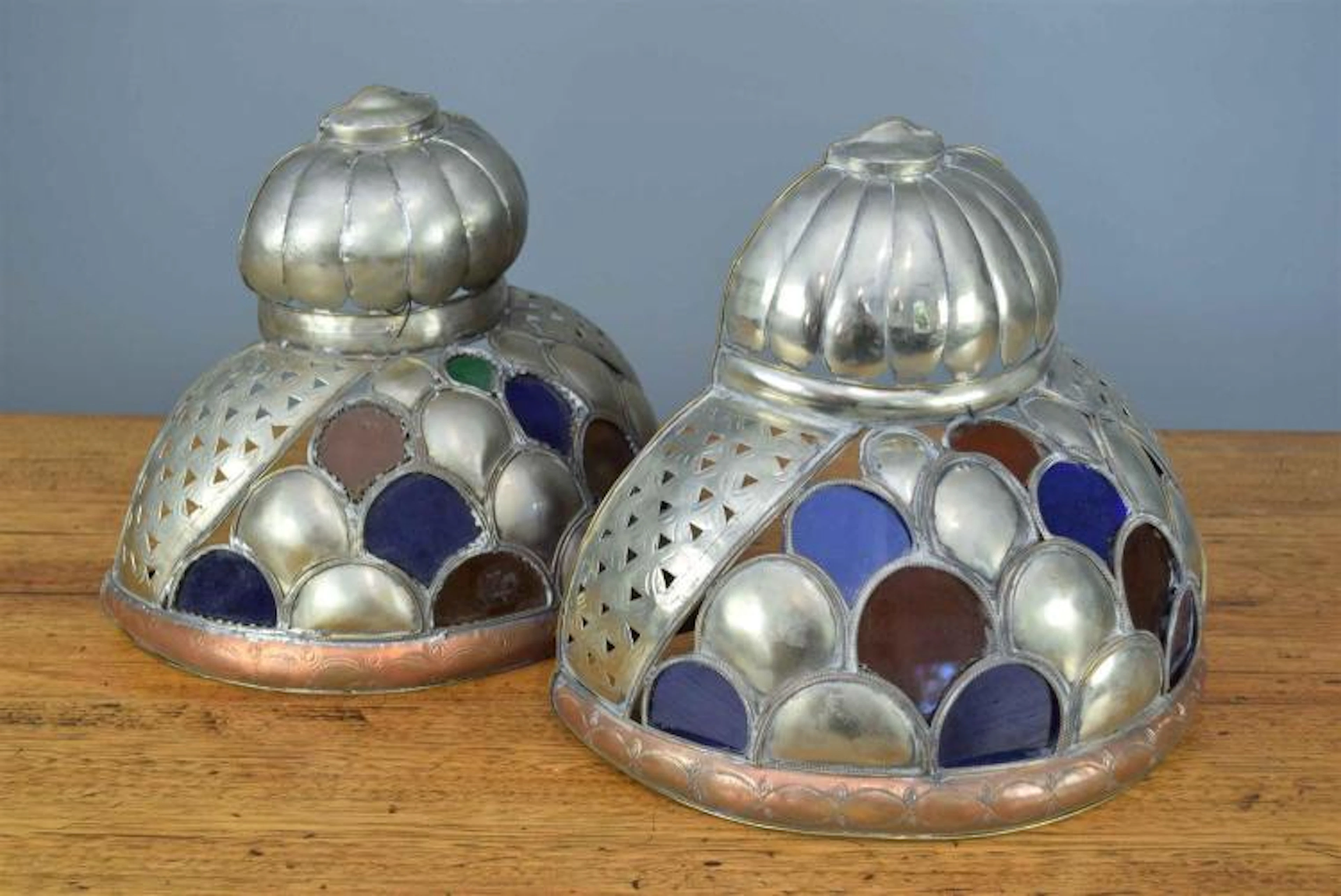 A PAIR OF MOROCCAN SILVER AND GLASS SCONCES