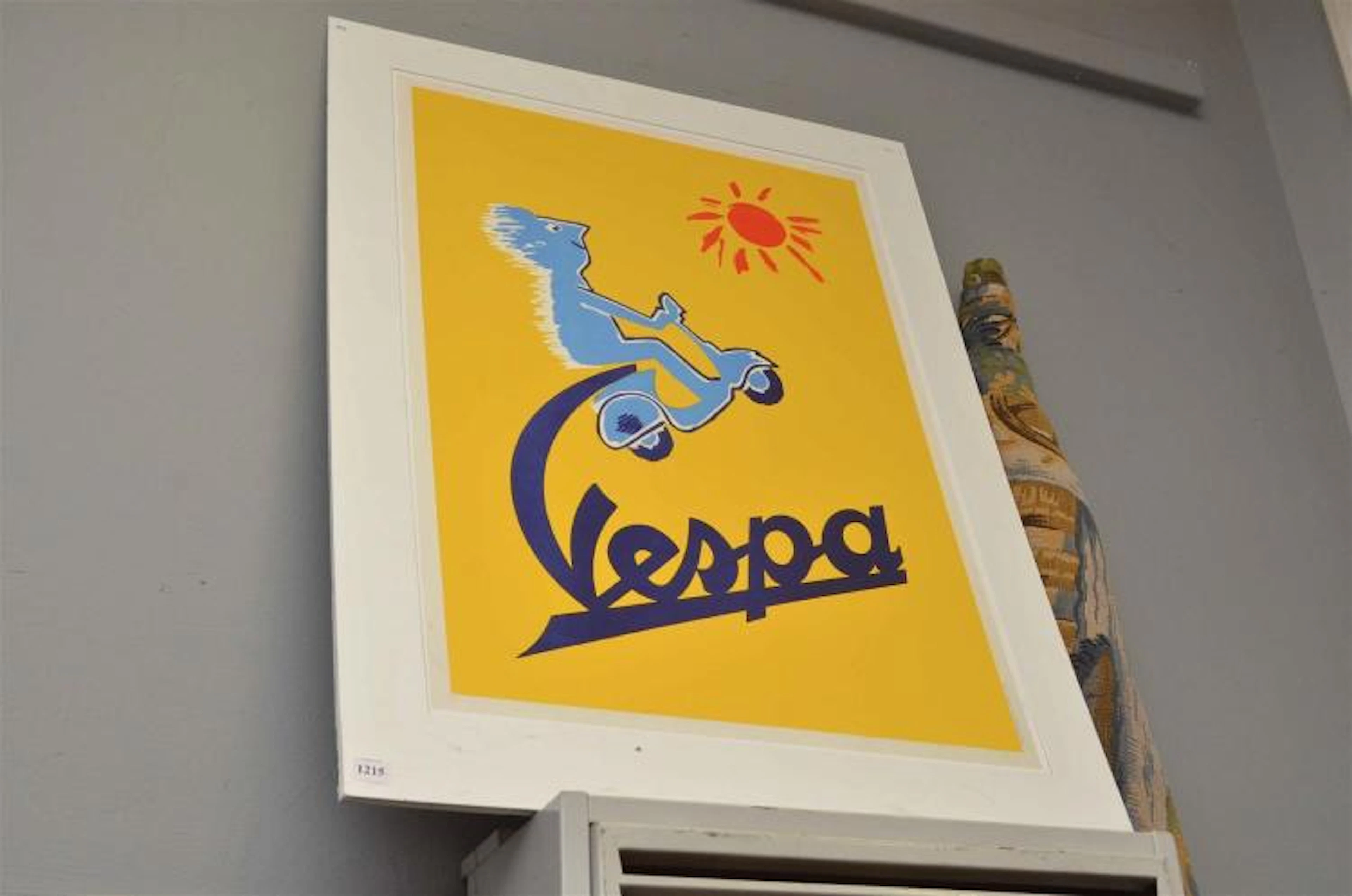AN UNFRAMED VESPA POSTER