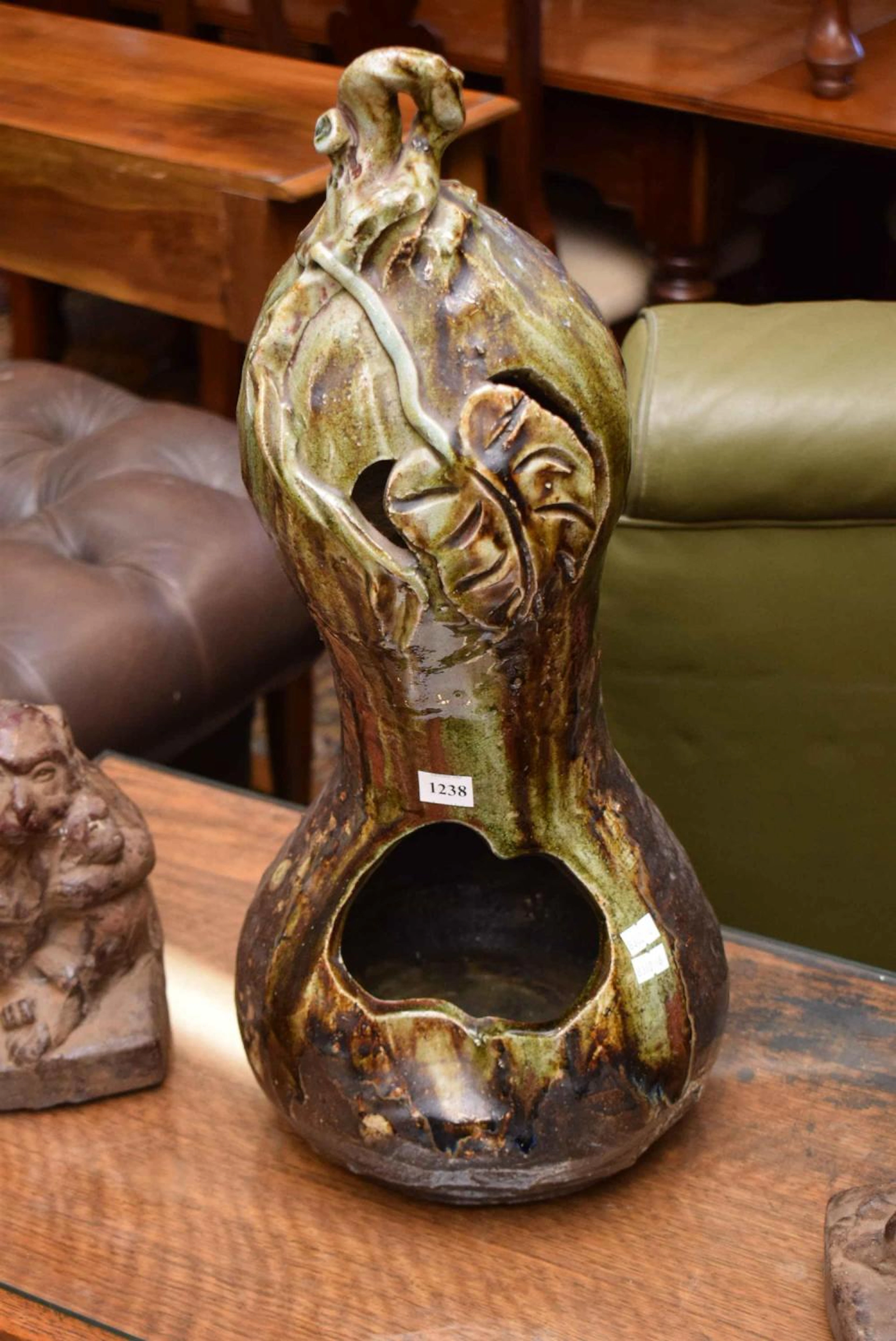 A JAPANESE CERAMIC SCULPTURED PLANTER AND POT