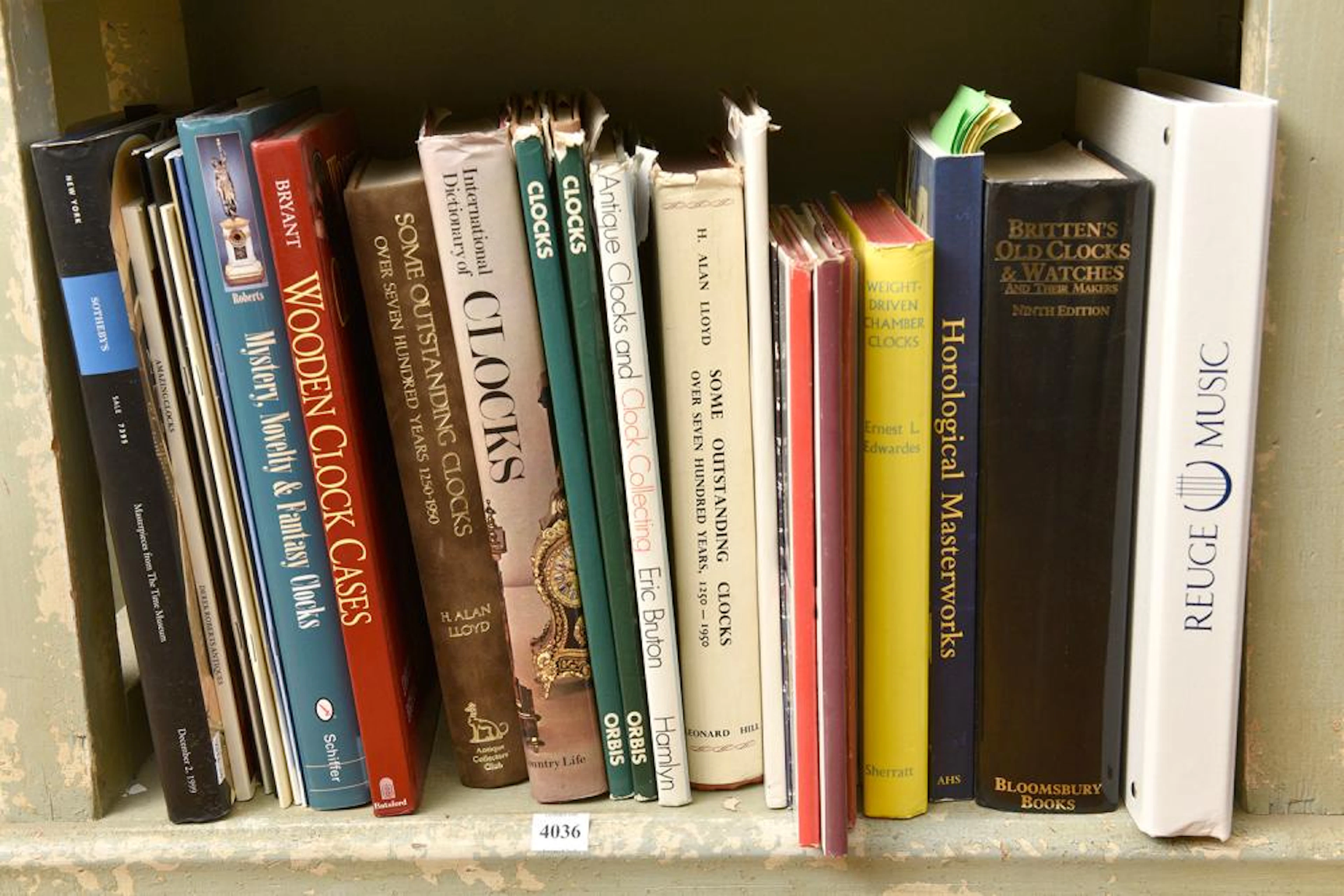 A SHELF OF ASSORTED CLOCK RELATED BOOKS INCLUDING WEIGHT DRIVEN CHAMBER CLOCKS