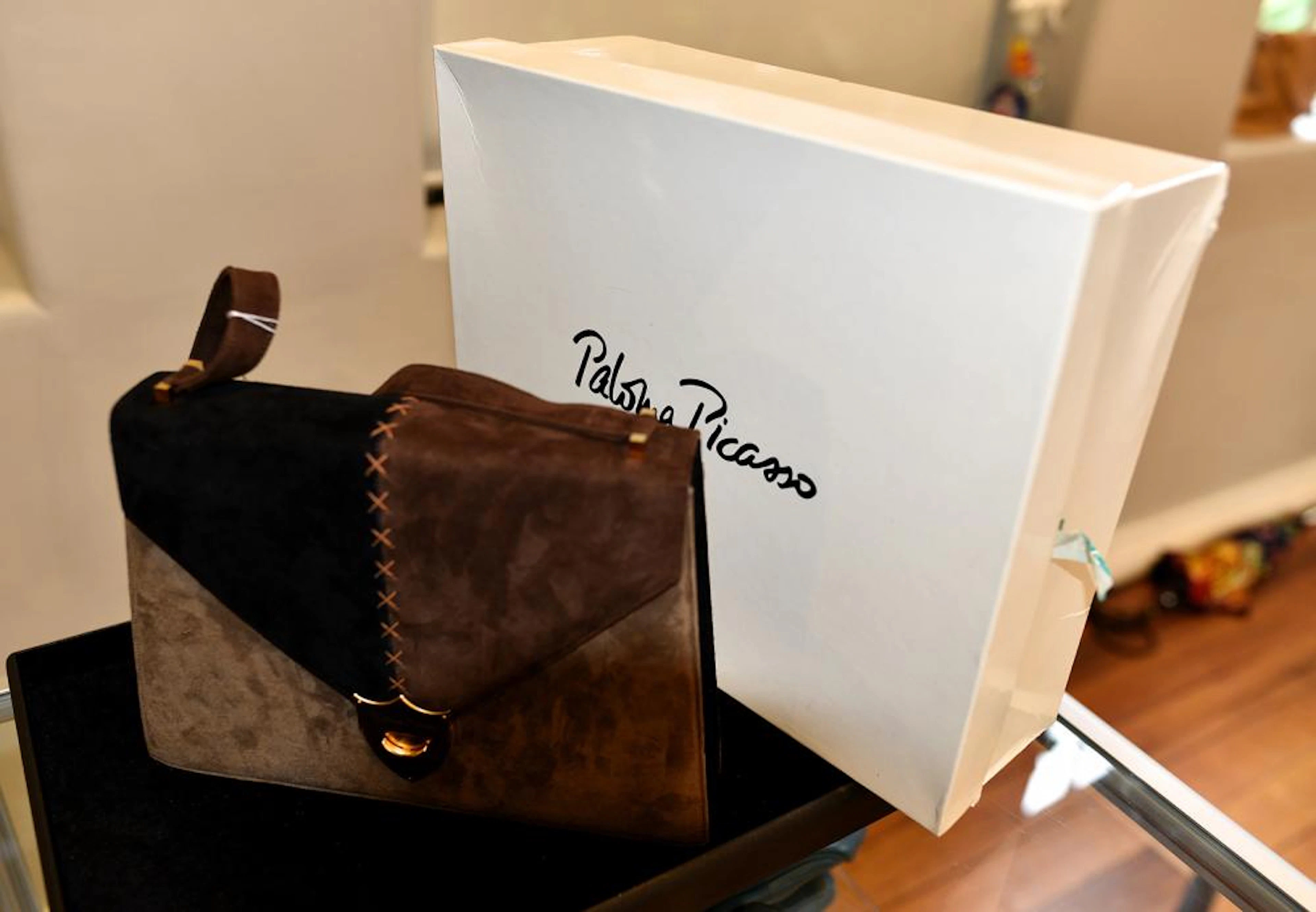 A SUEDE HANDBAG BY PALOMA PICASSO IN BROWN/BLACK