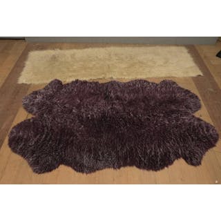 TWO MID-CENTURY RUGS INCLUDING ONE PURPLE LAMBS WOOL AND...
