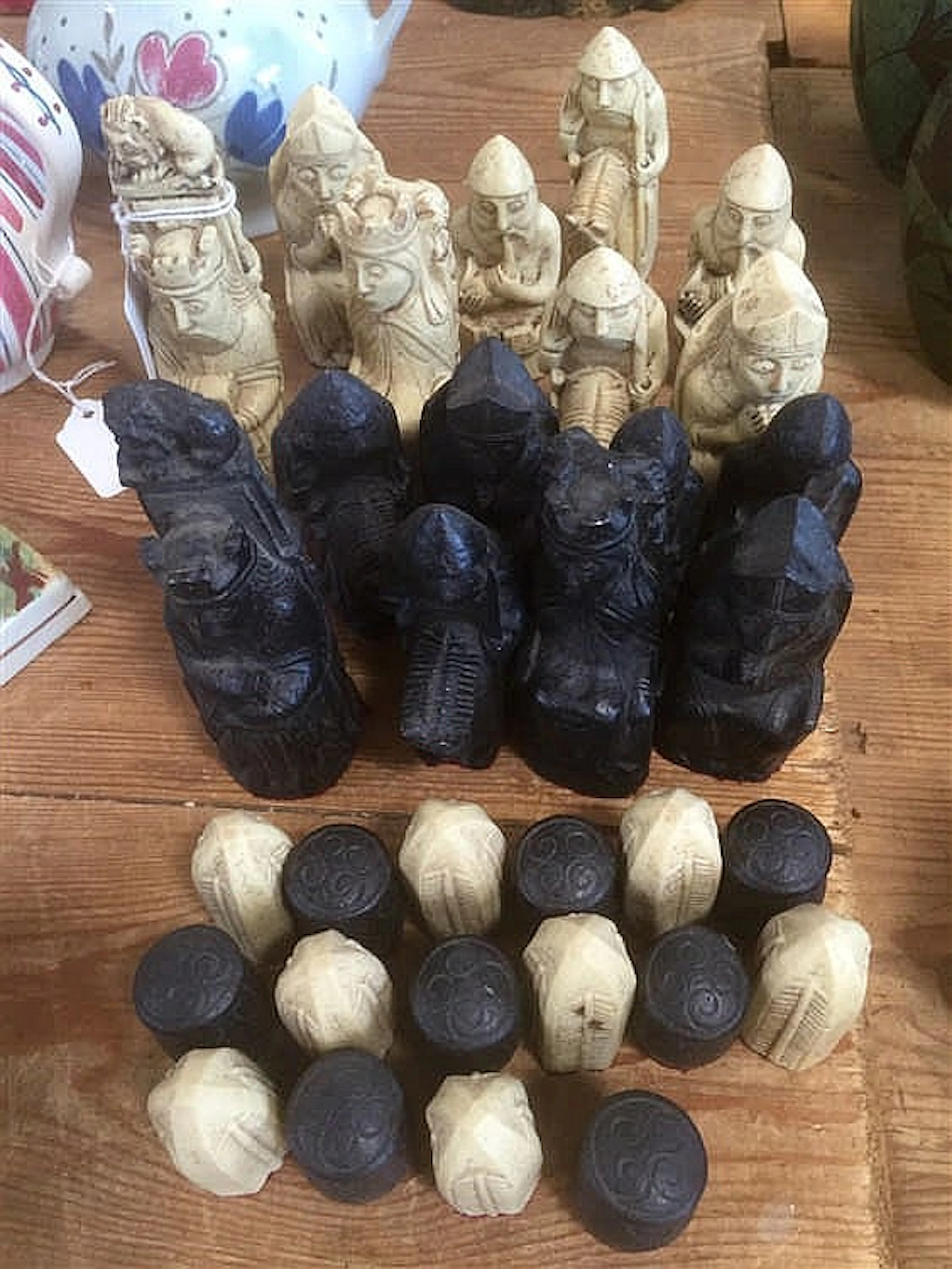 Resin chess pieces in the shape of kings, queens, musicians and courtiers