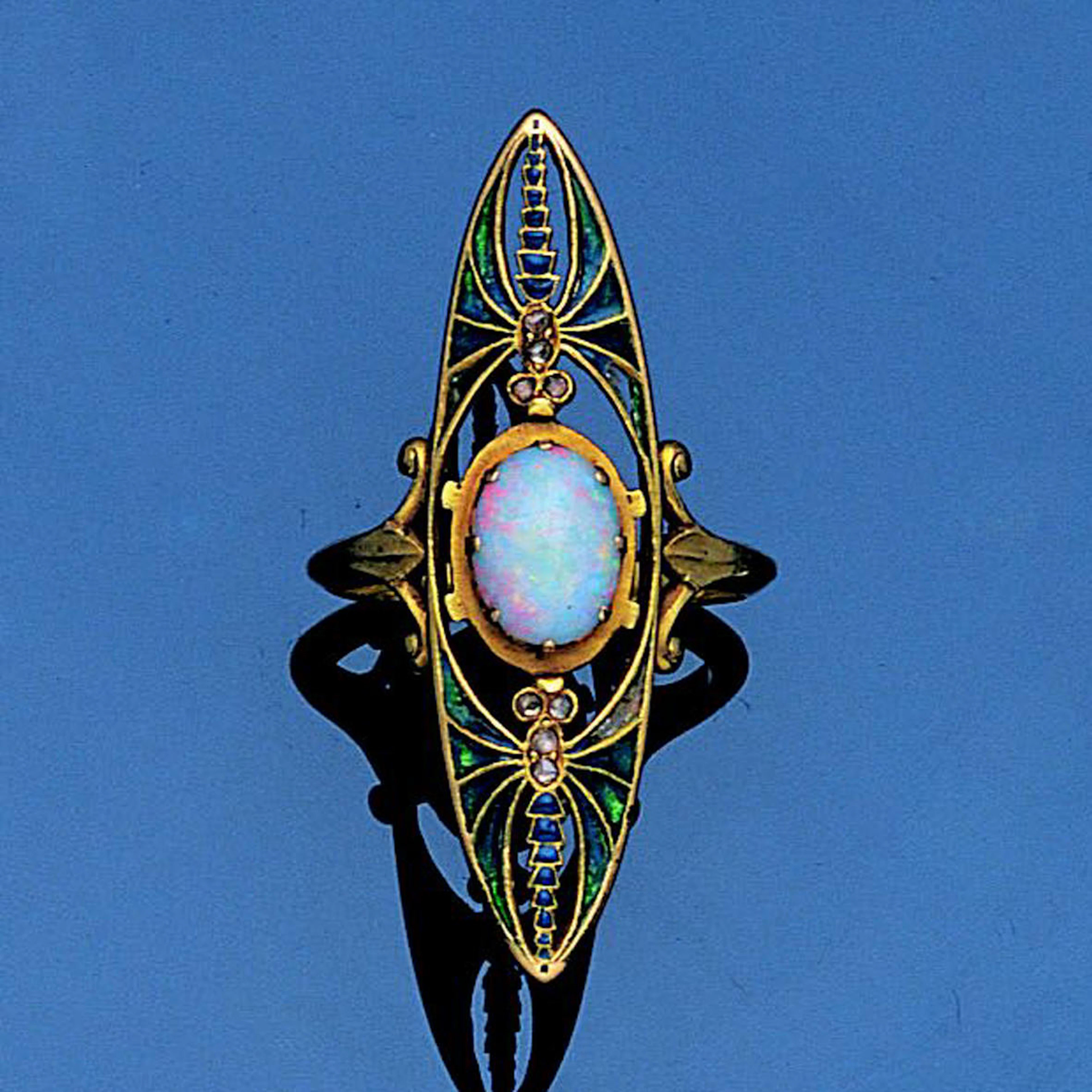 An art nouveau plique-à-jour enamel, diamond and opal ring, by Eugène Feuillâtre,