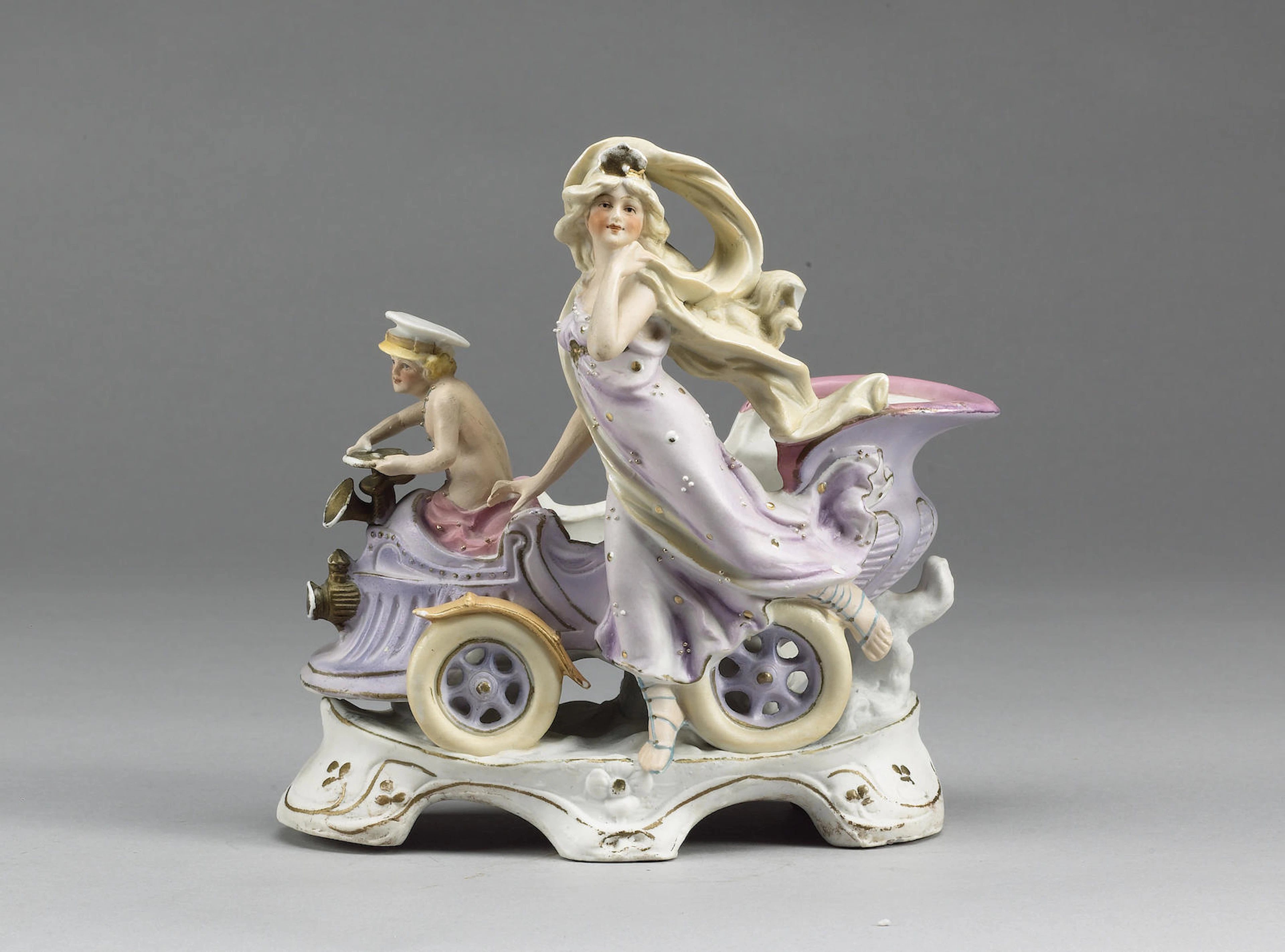 A Cherub & Goddess china deskpiece, circa 1897, length 7½in