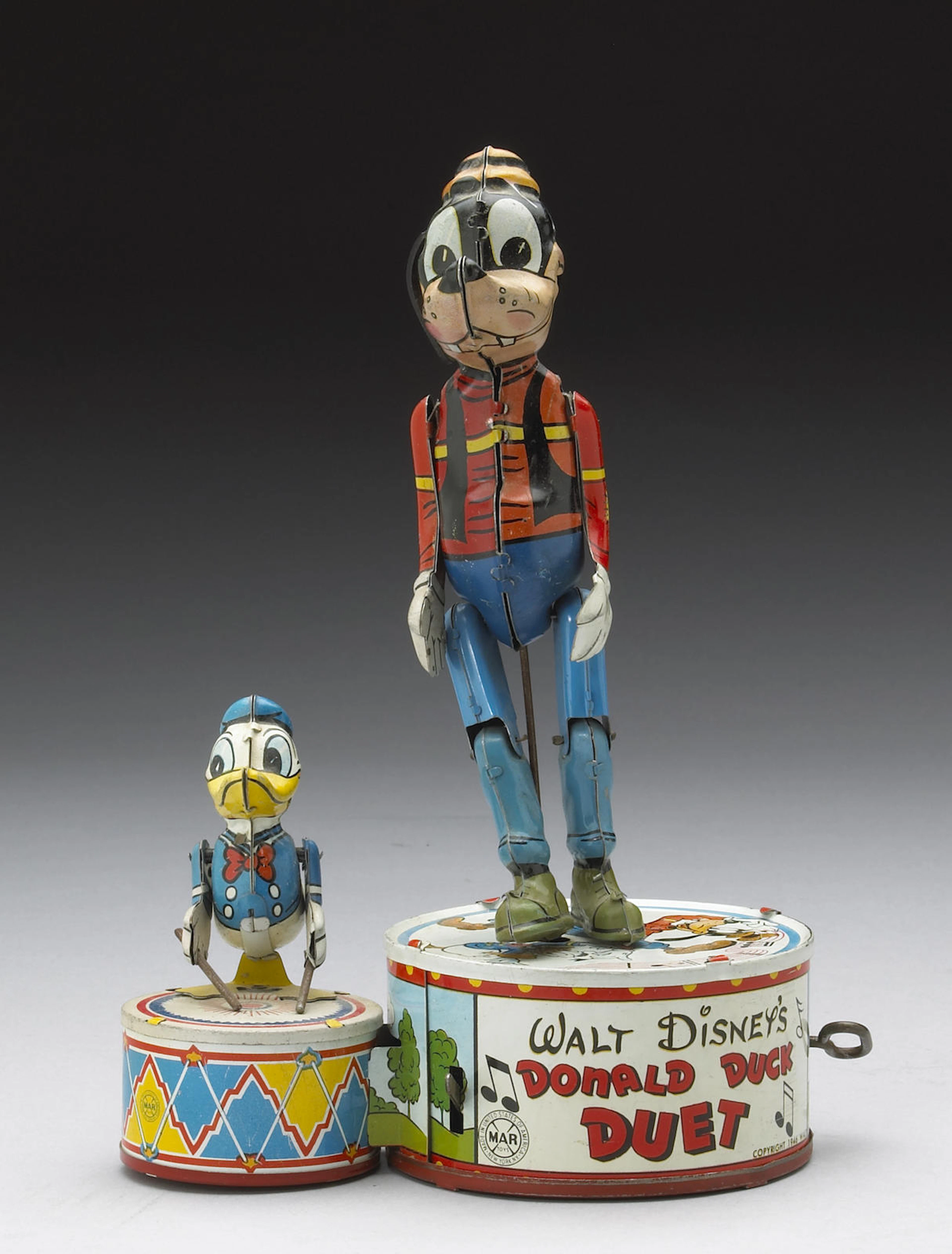 A Donald Duck Duet tin wind-up toy Height: 11in