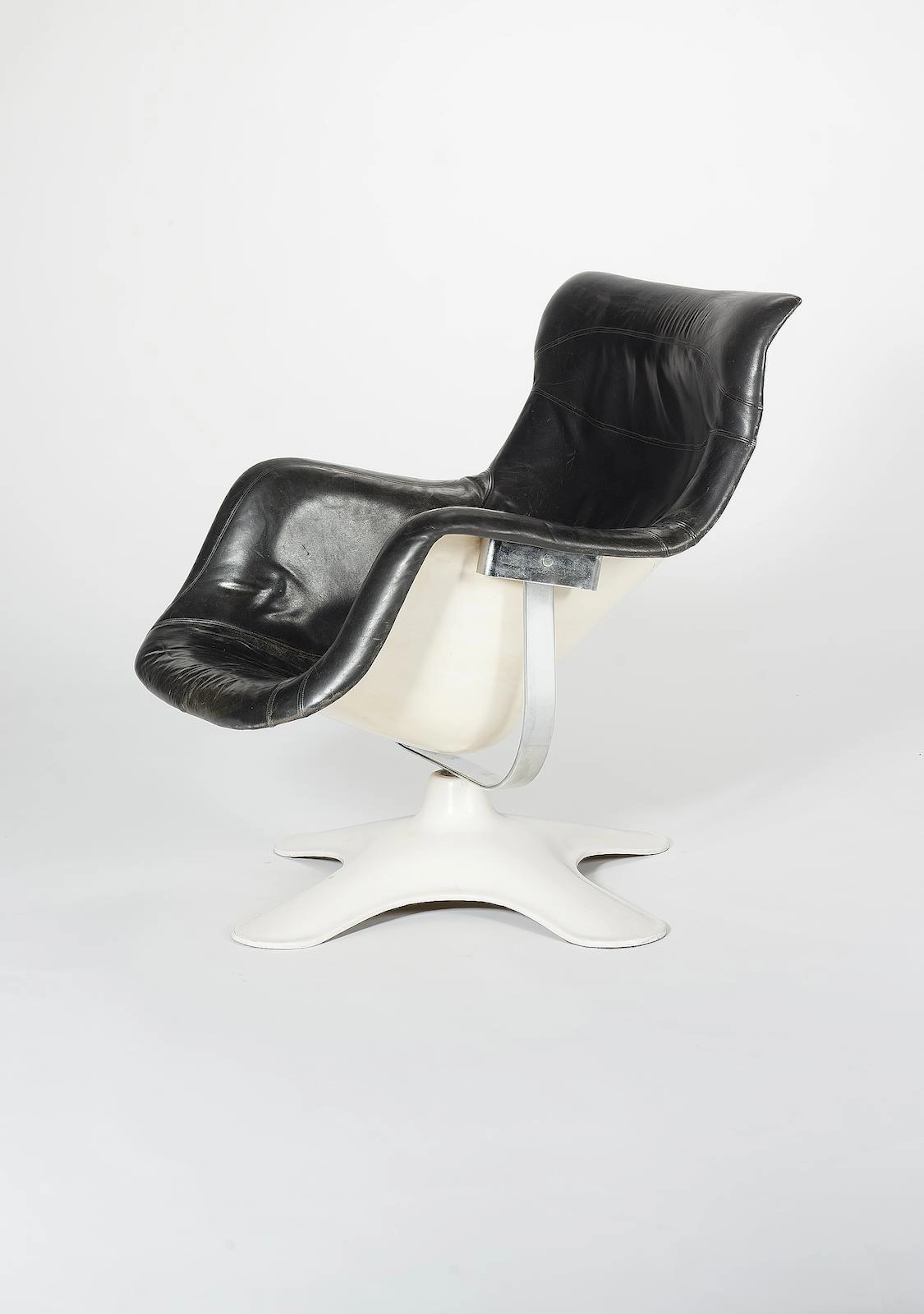 Yrjö Kukkapuro for Haimi, a Karuselli chair, designed 1964-5 white fibreglass shell with black leather upholstery
