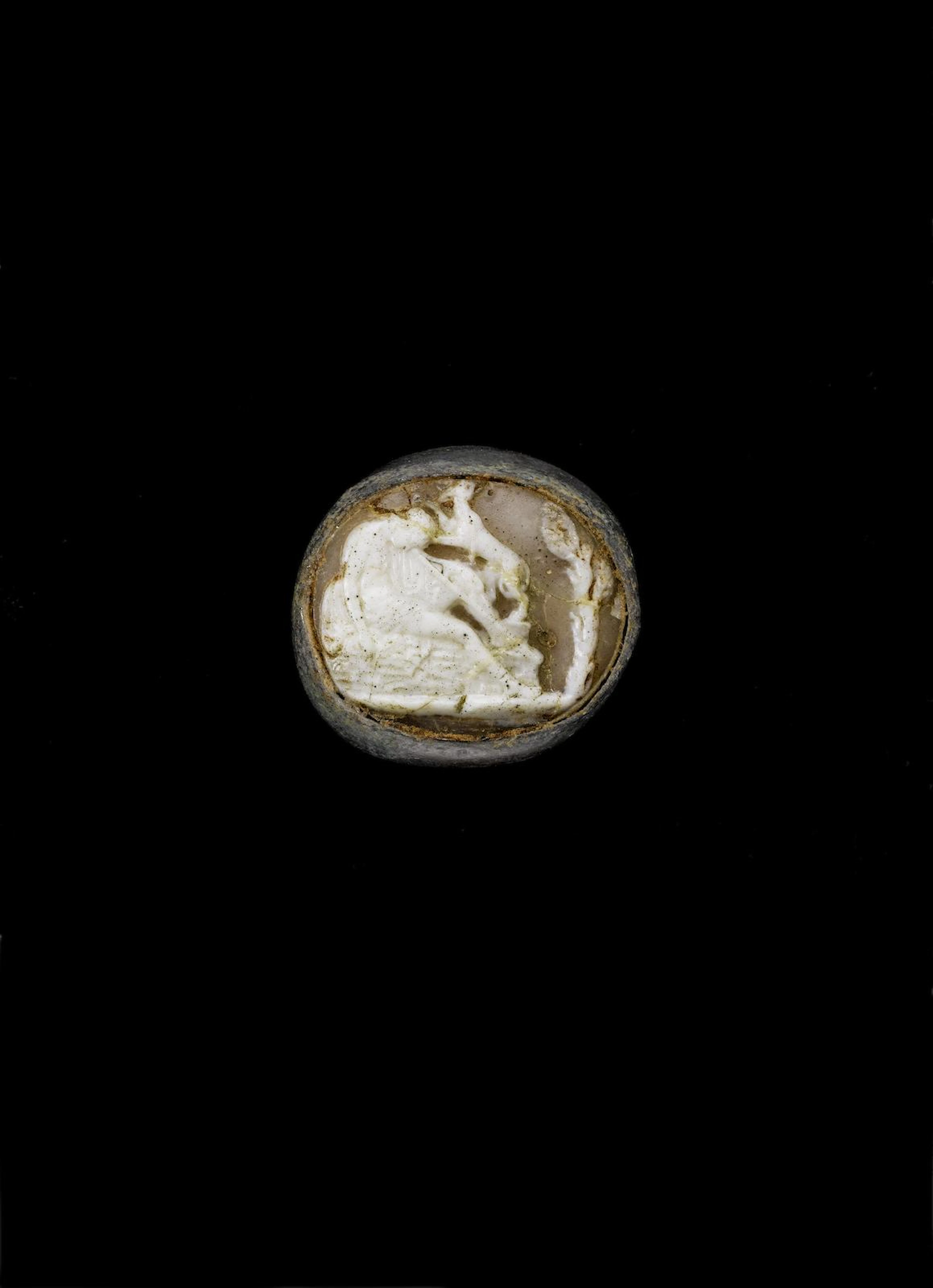 A large bronze hunting cameo ring