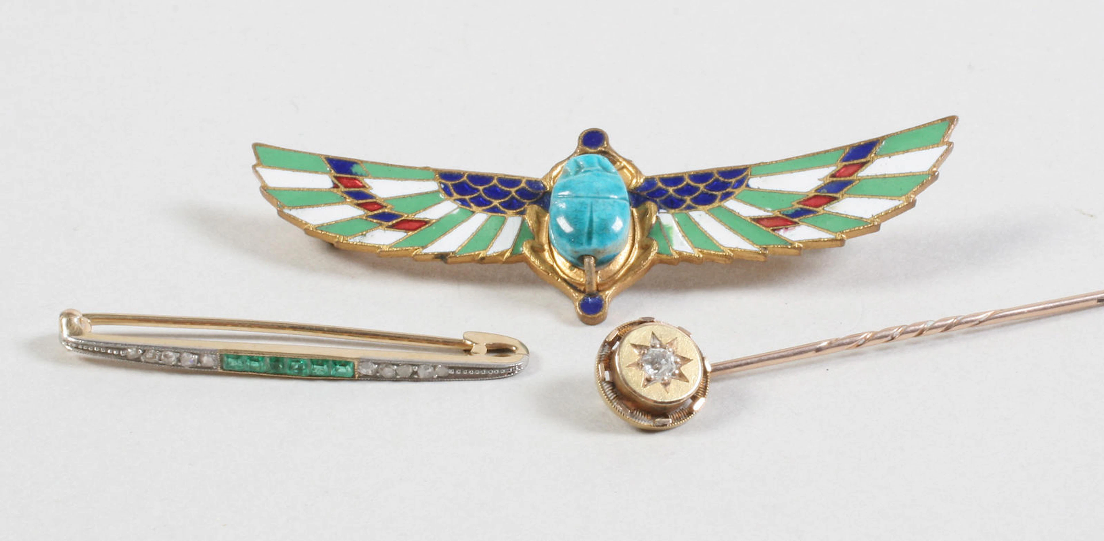 An Egyptianesque enamel brooch Unmarked,