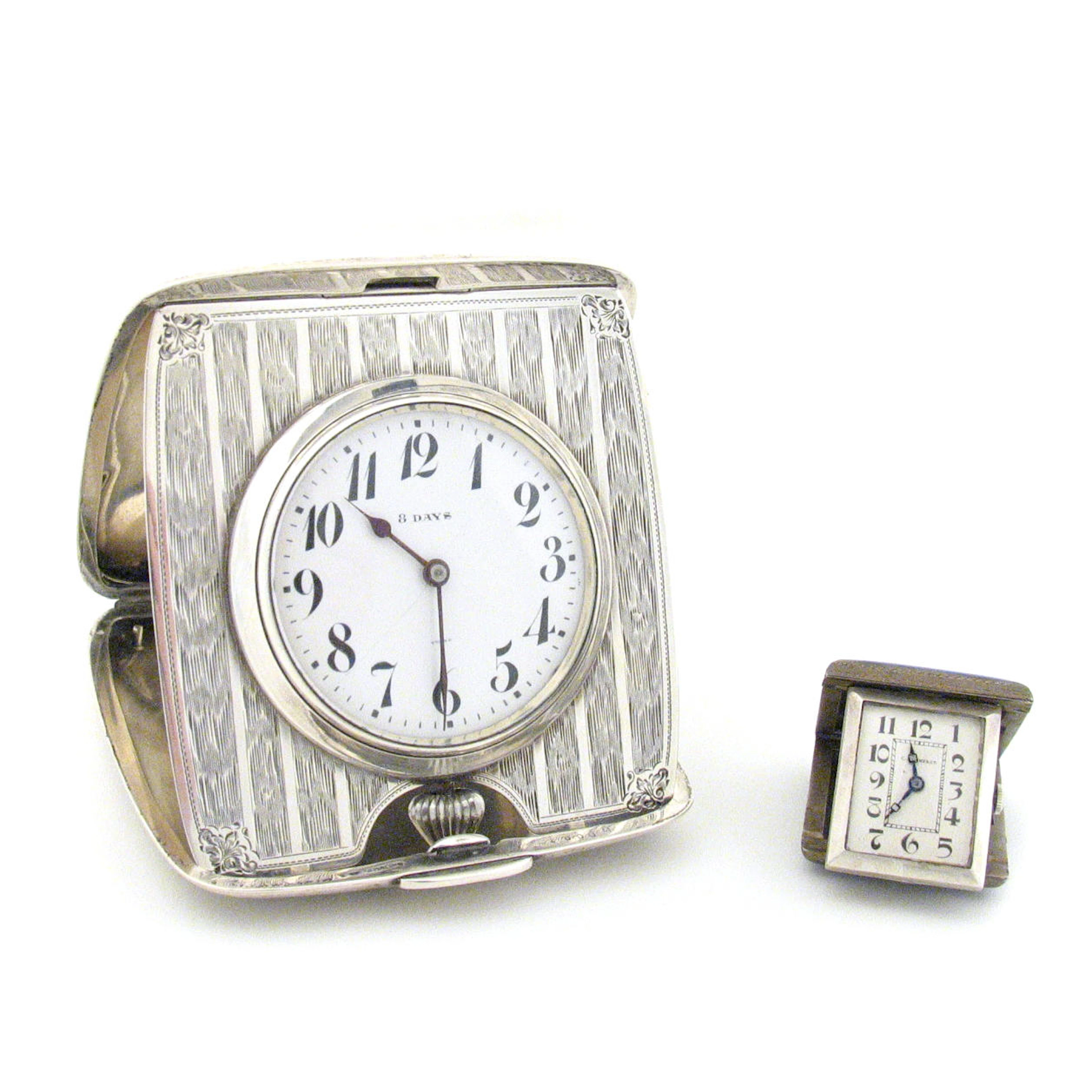 Two Silver Traveling Clocks