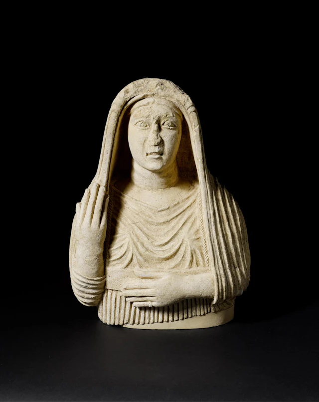 A Roman limestone funerary female bust