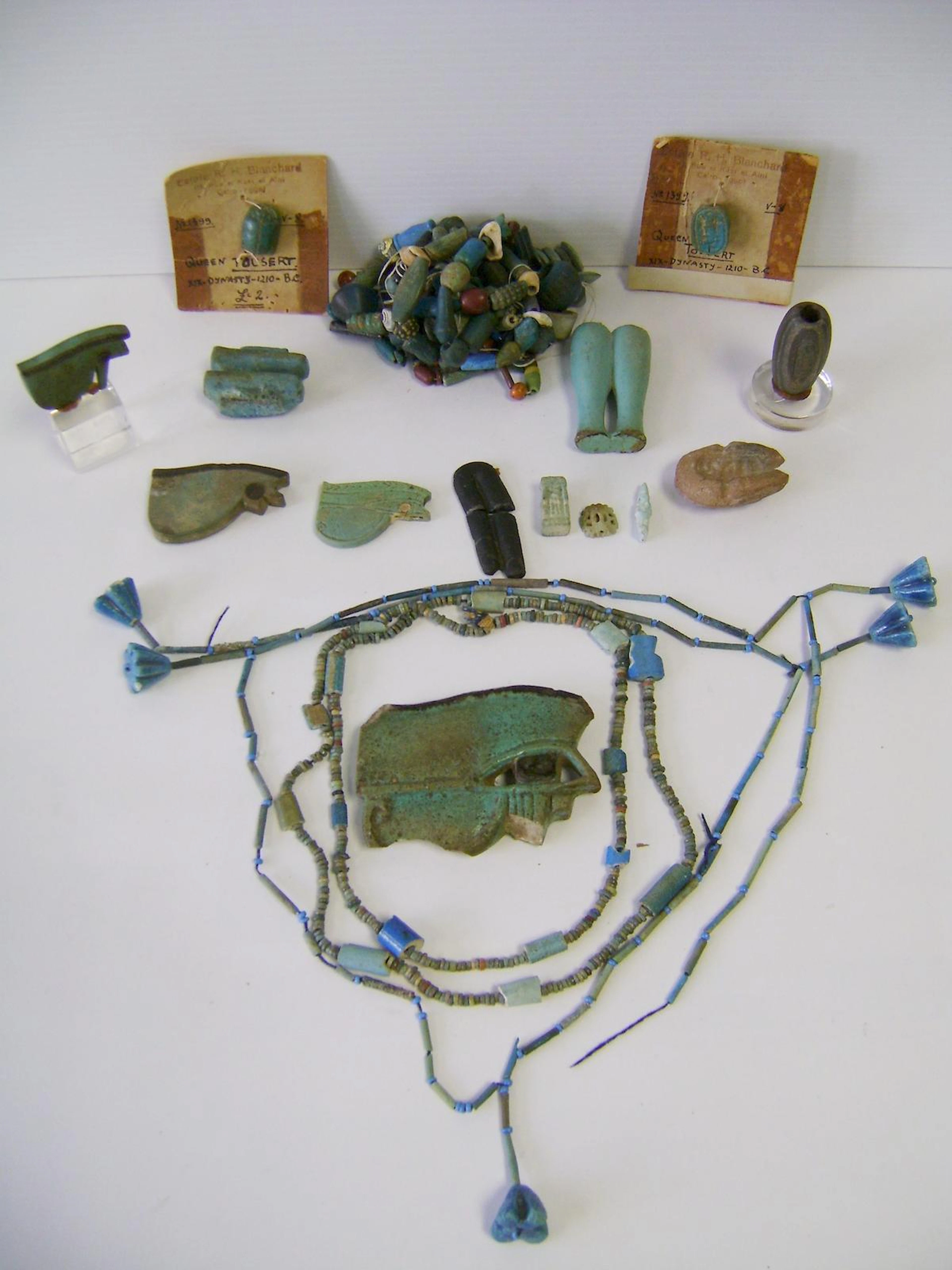 A group of Egyptian amulets and beads a lot
