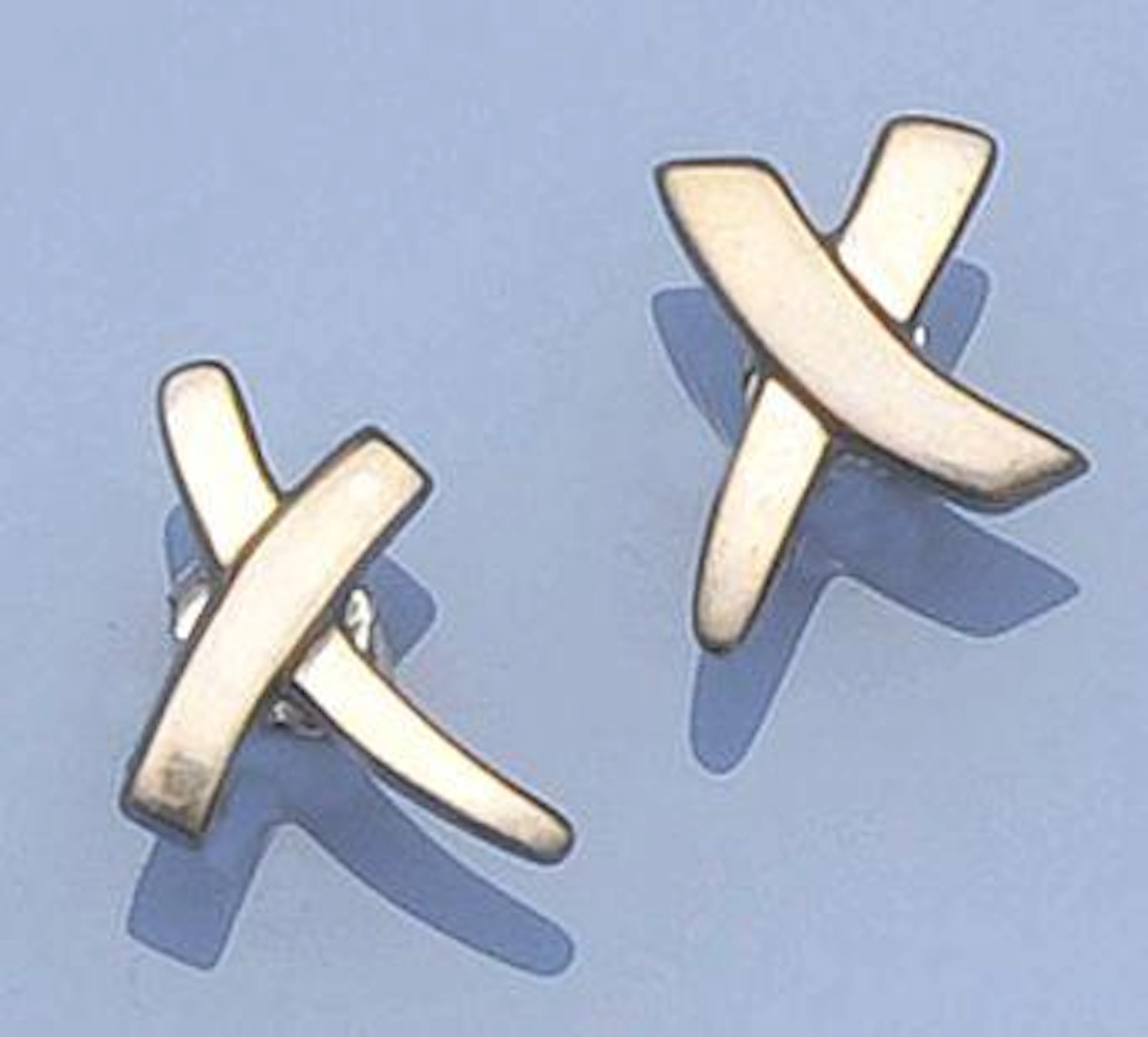 A pair of silver cross earpendants, by Paloma Picasso for Tiffany & Co