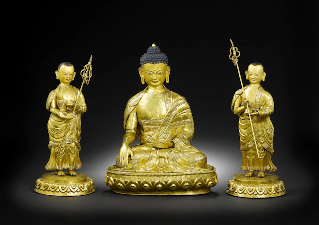 A gilt-copper figure of Sakyamuni Buddha with two attendants Circa 1800