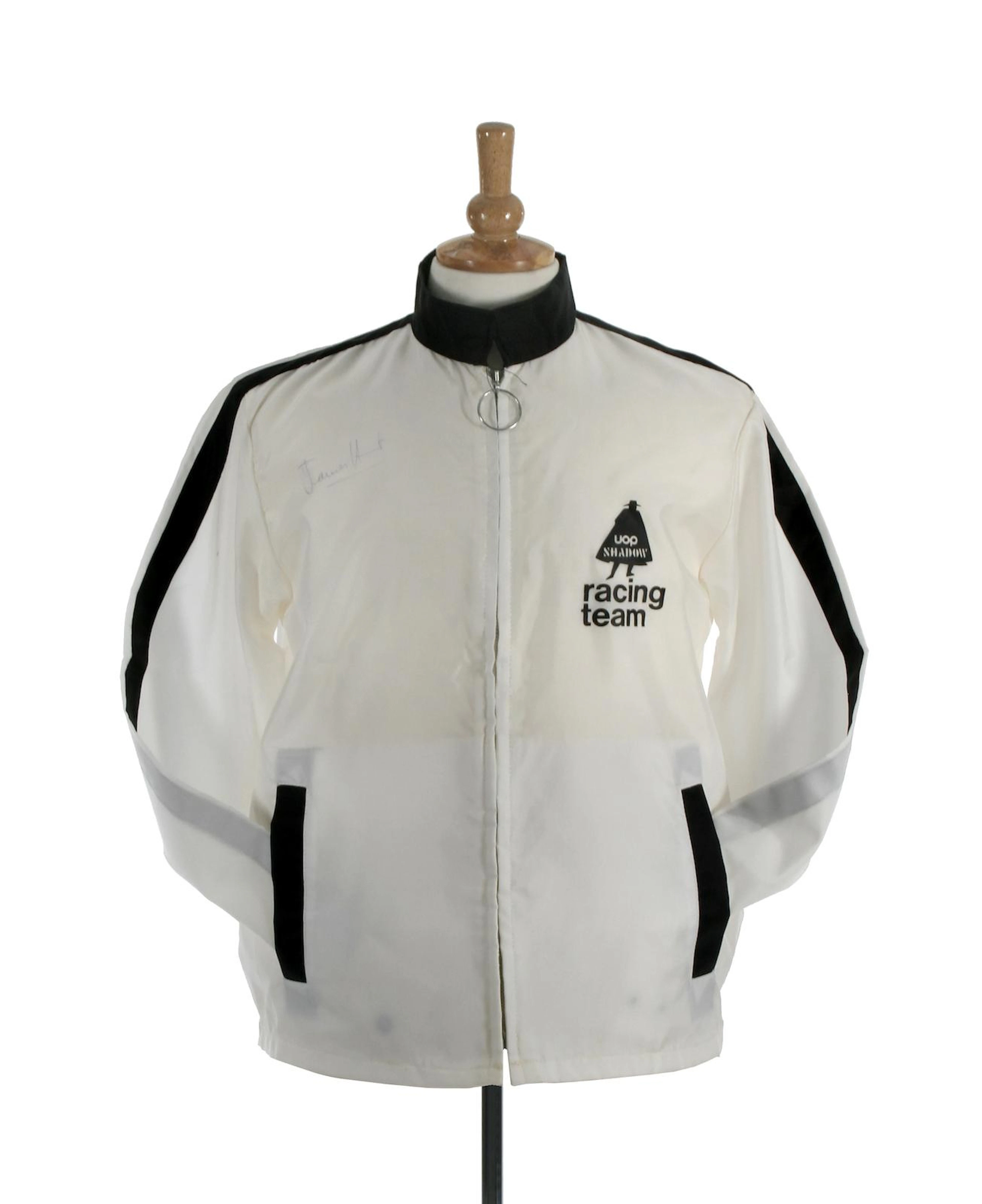 A James Hunt signed racing jacket and Grand Prix racing driver autograph book,